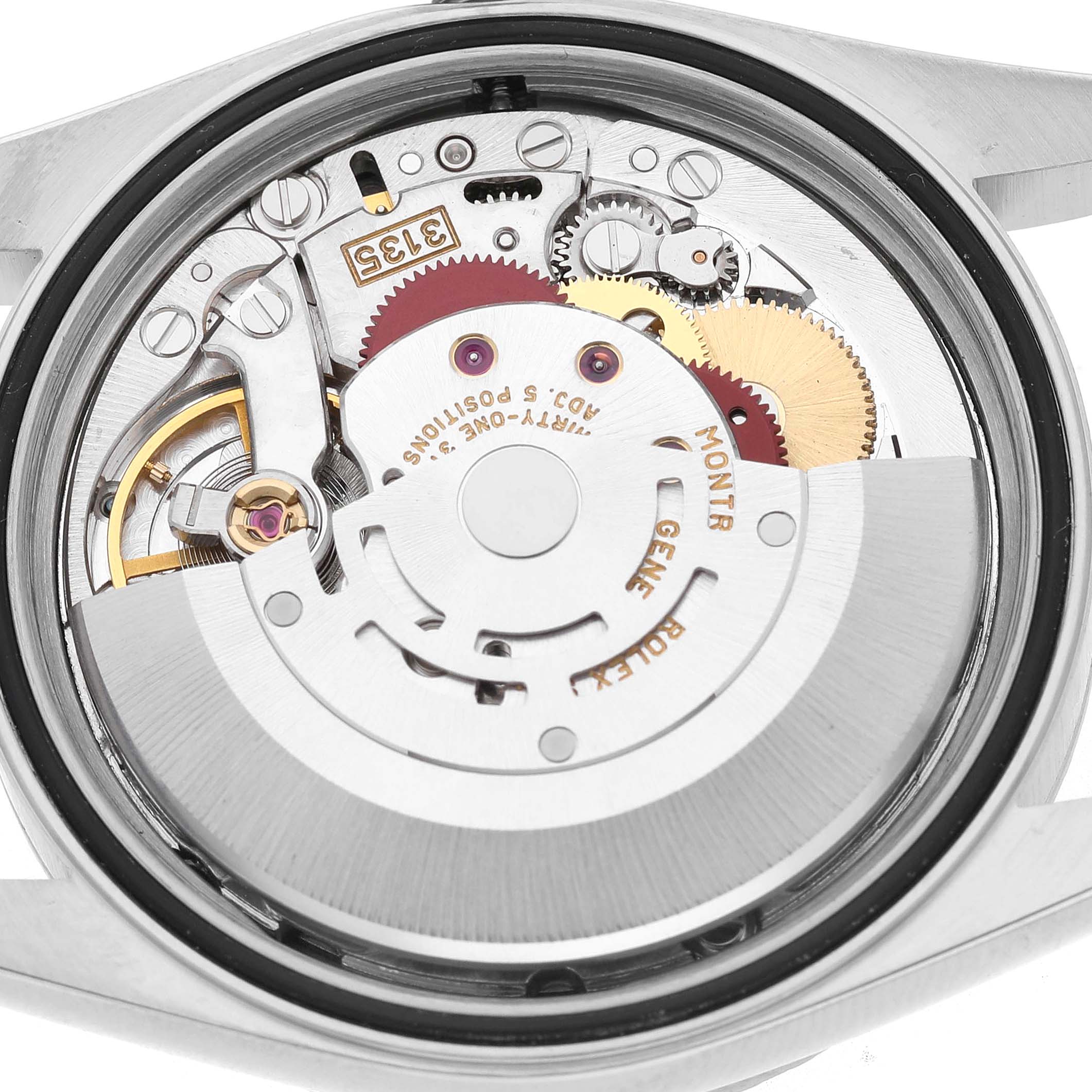 The image shows the movement and inner mechanism of a Rolex Datejust 16220 Men's Stainless Steel Blue Dial watch, viewed from the back.