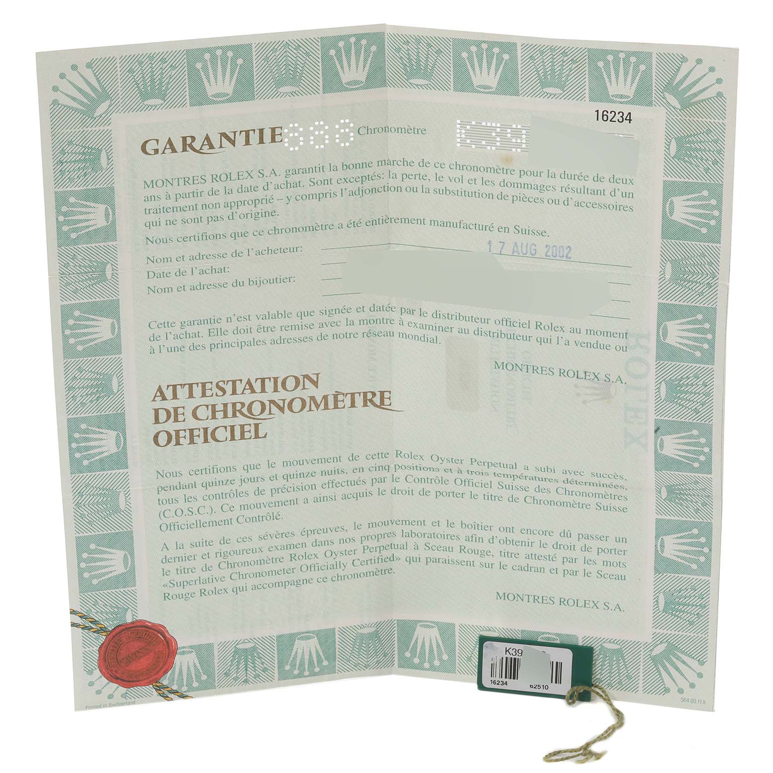 This image shows the warranty card and tags for a Datejust model by Rolex.