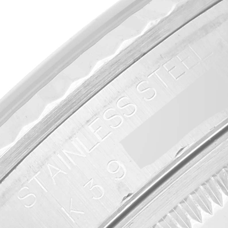 The image shows a close-up of the engraved stainless steel case side of a Rolex Datejust 16234 Men's Stainless Steel Blue Dial 16234 Men's Stainless Steel Blue Dial watch.