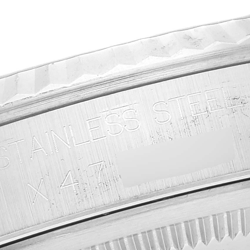 The image shows a close-up of the engraved text on the stainless steel case back of a Rolex Datejust 16234 Men's Stainless Steel Blue Dial 16234 Men's Stainless Steel Blue Dial watch.