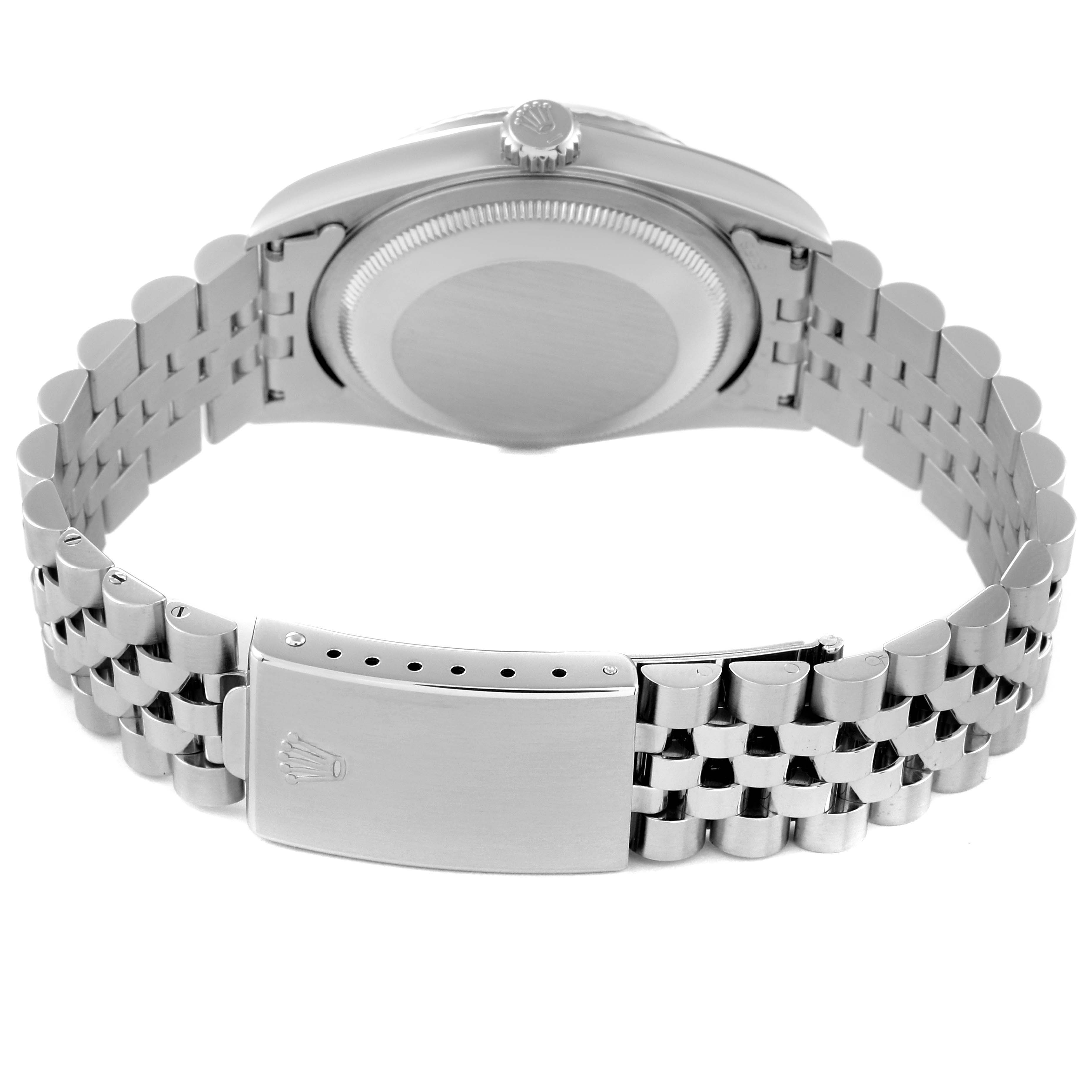 The image showcases the backside of a Rolex Datejust 16234 Men's Stainless Steel Silver Dial 16234 Men's Stainless Steel Silver Dial watch, focusing on its case, crown, and bracelet.