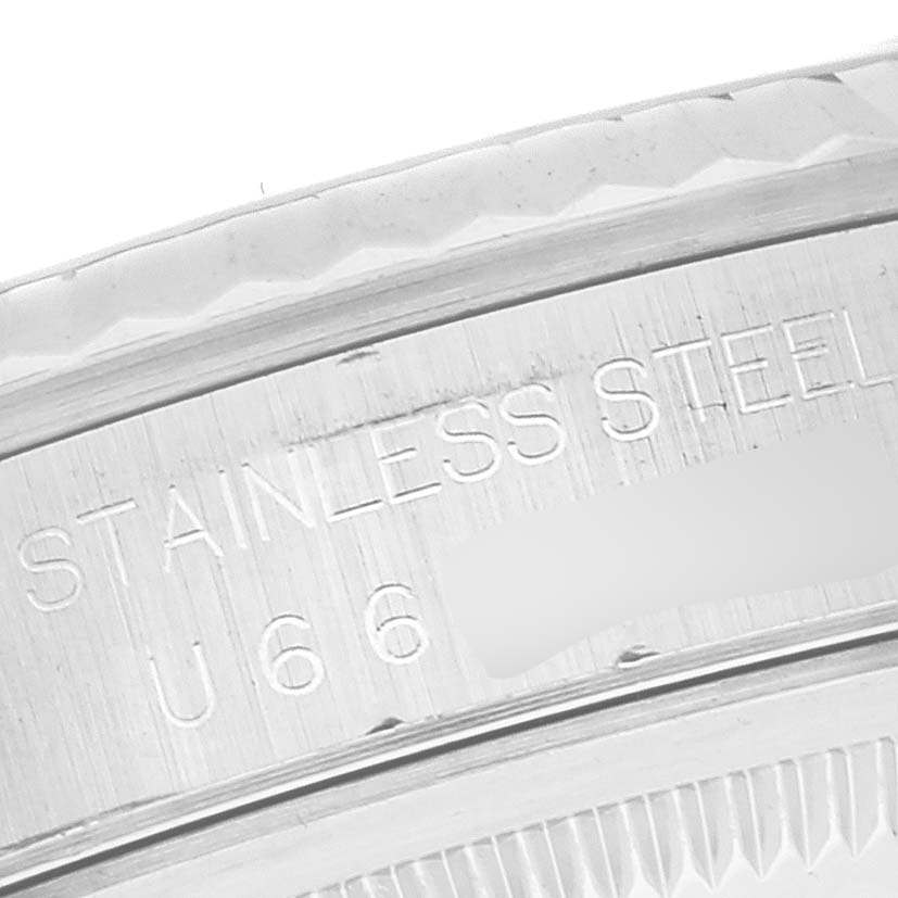 The image shows a close-up of the stainless steel bezel and case-back edge of a Rolex Datejust 16234 Men's Stainless Steel Silver Dial 16234 Men's Stainless Steel Silver Dial watch.