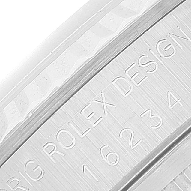 The image shows a close-up angle of a bezel engraving on the Rolex Datejust 16234 Men's Stainless Steel Silver Dial 16234 Men's Stainless Steel Silver Dial watch, featuring model and design details.