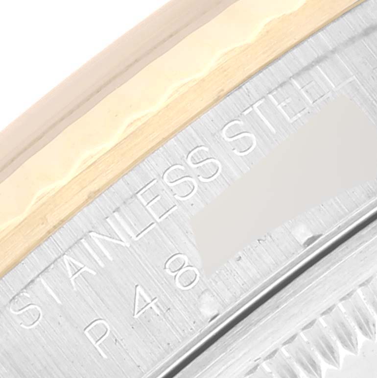 The image shows a close-up of the bezel and part of the watch case of a Rolex Datejust 16233 Men's Steel and Gold (two tone) Champagne Dial 16233 Men's Steel and Gold (two tone) Champagne Dial, highlighting the stainless steel material.