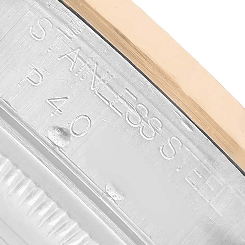 The image shows a close-up of the Rolex Datejust 16233 Men's Stainless Steel Black Dial's case side, featuring the "STAINLESS STEEL" engraving.