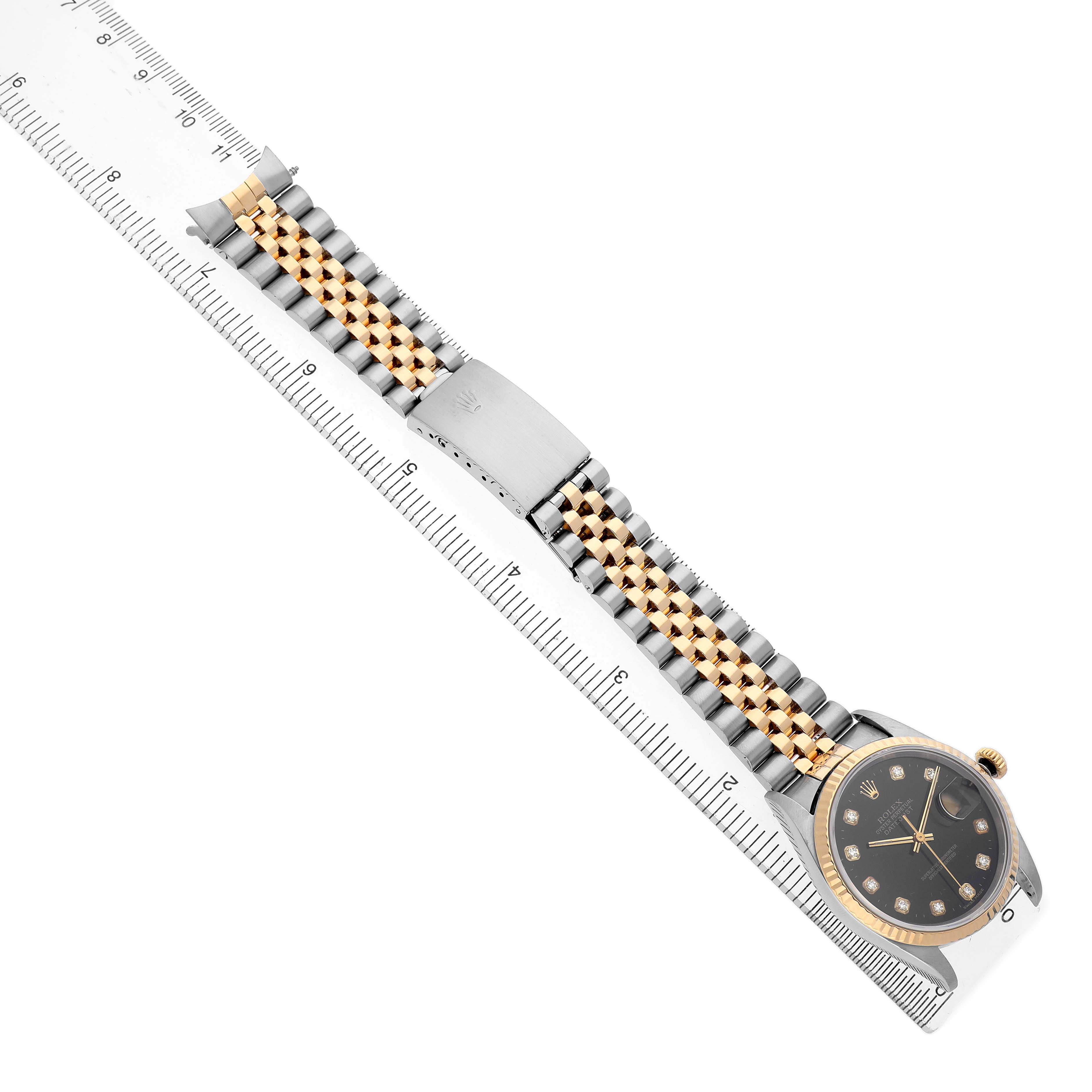 The Rolex Datejust 16233 Men's Stainless Steel Black Dial watch is shown from a top-down angle, displaying its bracelet and part of the case with a visible clasp.