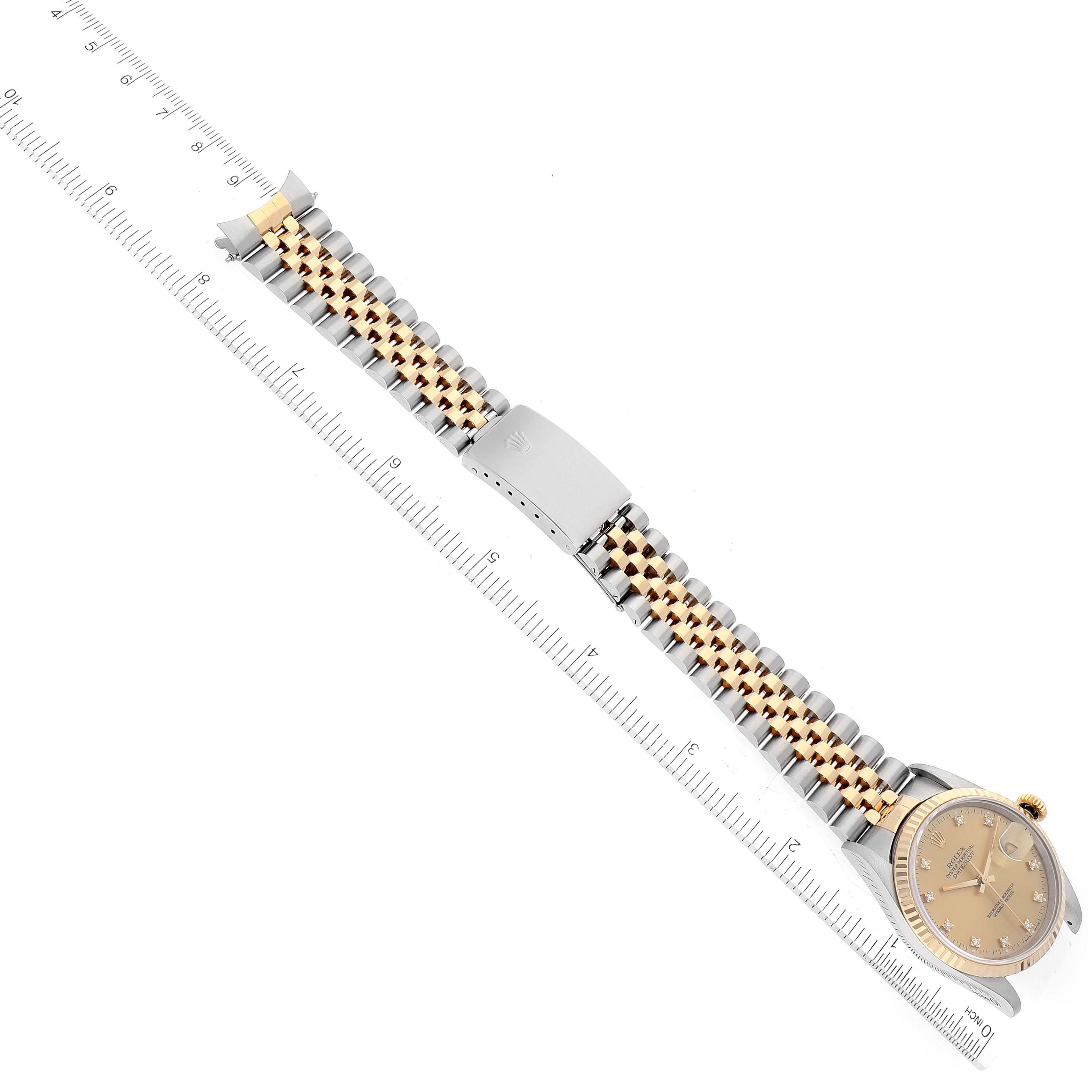 The image shows the Rolex Datejust 16233 Men's Steel and Gold (two tone) Champagne Dial 16233 Men's Steel and Gold (two tone) Champagne Dial watch at an overhead angle, displaying its bracelet, clasp, and a portion of the case and dial.