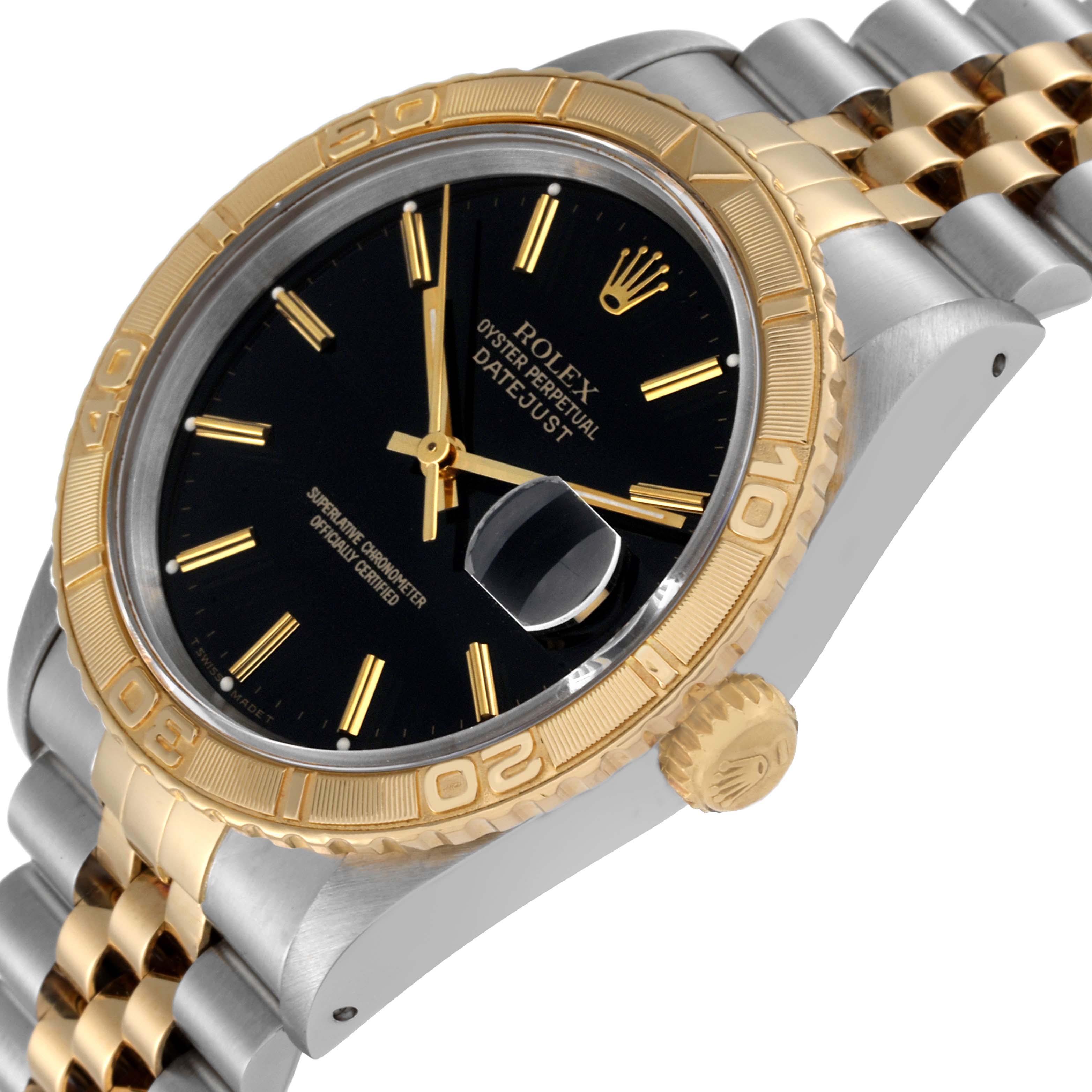 The Rolex Turn-o-Graph 16263 Men
s Steel and Gold (two tone) Black Dial 16263 Men
s Steel and Gold (two tone) Black Dial watch is shown at an angle highlighting the face, bezel, crown, and part of the bracelet.