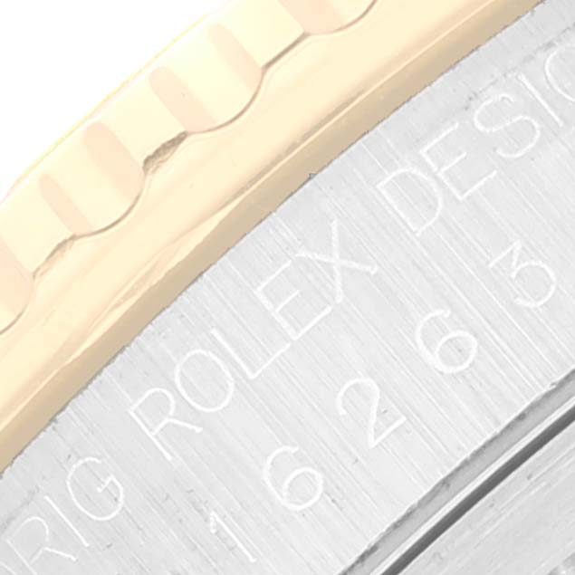 This image shows a close-up of the bezel and engraved edge of a Rolex Turn-o-Graph 16263 Men
s Steel and Gold (two tone) Black Dial 16263 Men
s Steel and Gold (two tone) Black Dial watch.