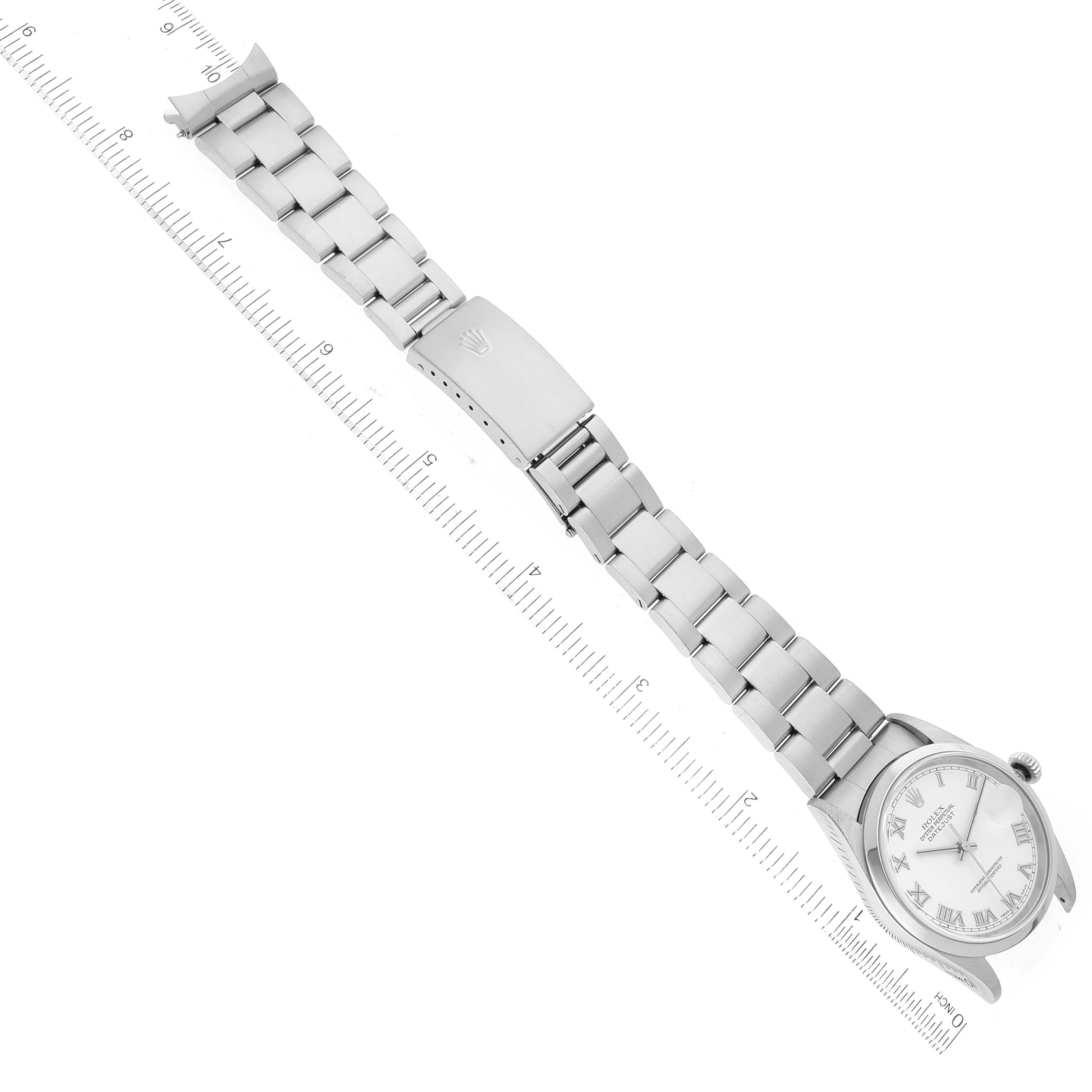 The image shows a Rolex Datejust 16200 Men's Stainless Steel White Dial 16200 Men's Stainless Steel White Dial watch placed flat, highlighting the bracelet and clasp, with a ruler for measurement.