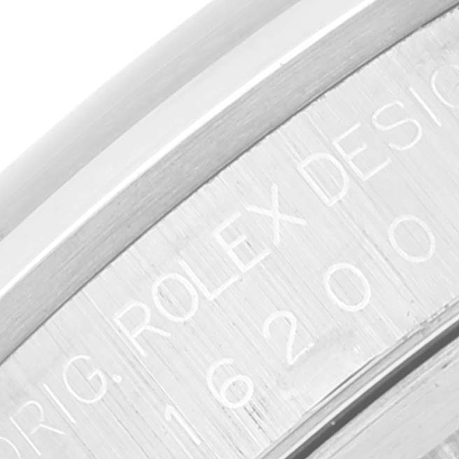 Close-up of the Rolex Datejust 16200 Men's Stainless Steel White Dial 16200 Men's Stainless Steel White Dial watch's engraved case, focusing on the model number and "Rolex Design" text.