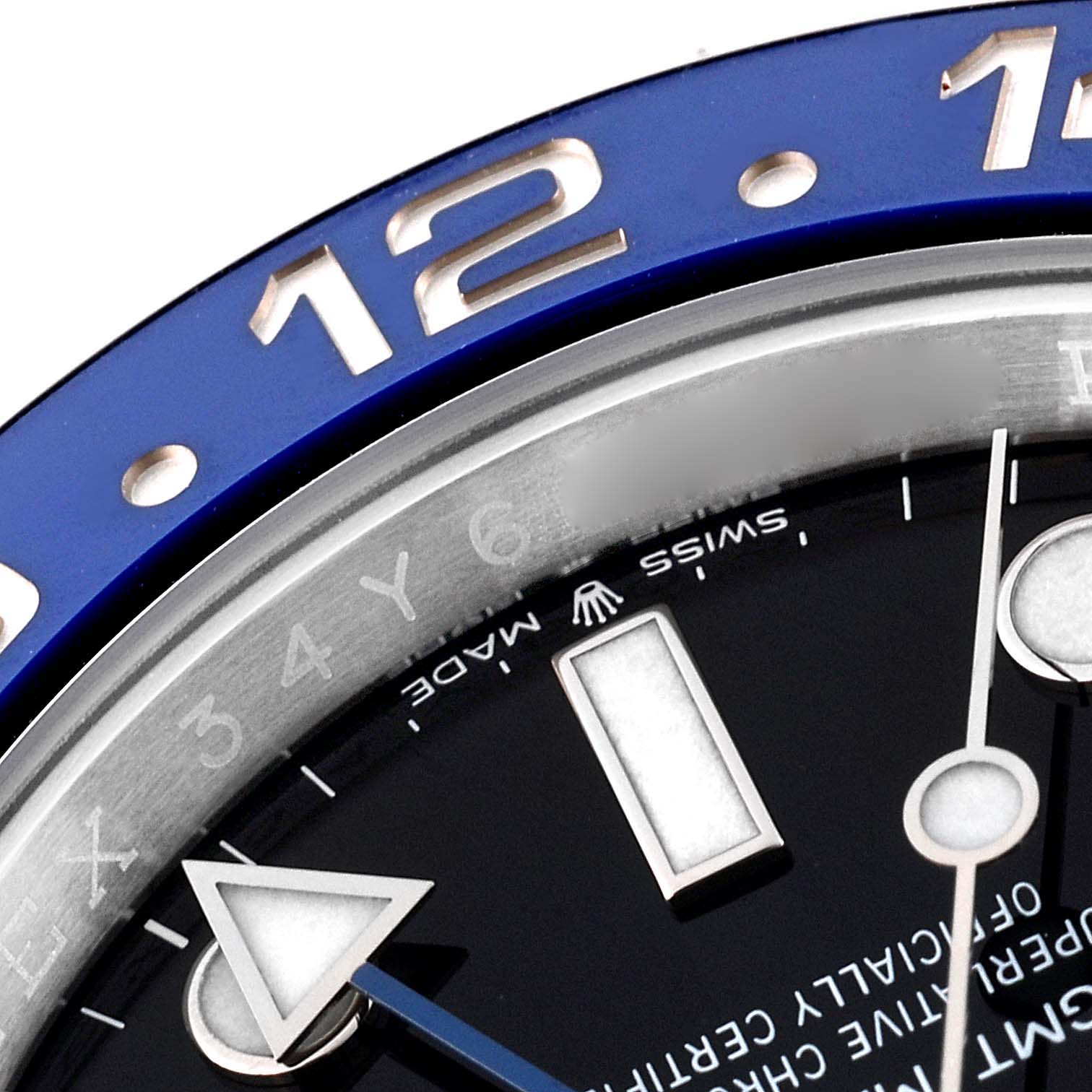 Close-up of the bezel, hour markers, and part of the dial of the Rolex GMT-Master 126710 Men
s Stainless Steel Black Dial 126710 Men
s Stainless Steel Black Dial watch.