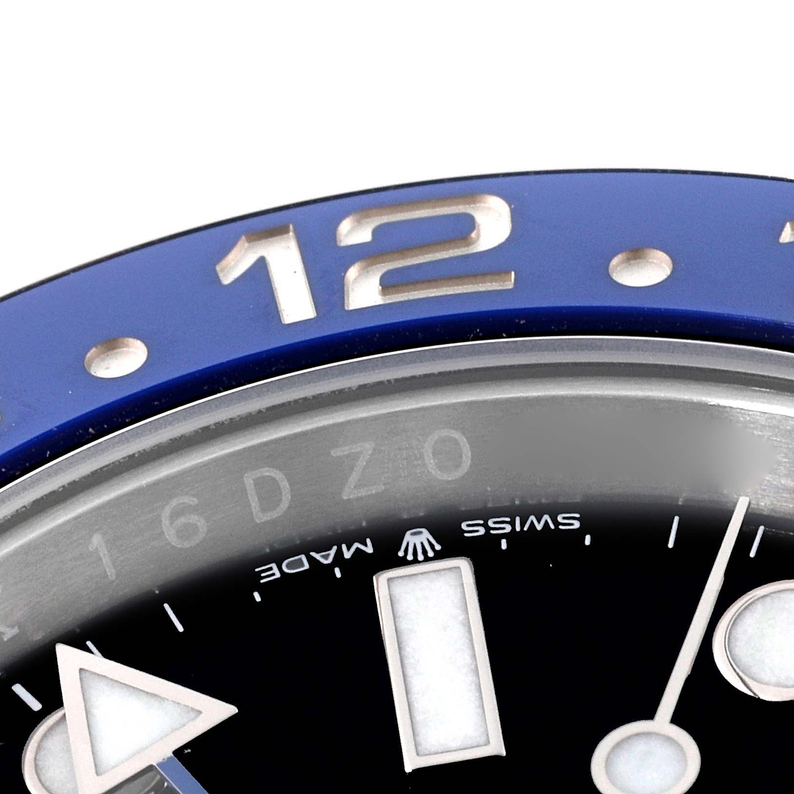 The image shows a close-up angle of the bezel, dial, and hour markers of a Rolex GMT-Master 126710 Men's Stainless Steel Black Dial 126710 Men's Stainless Steel Black Dial watch.