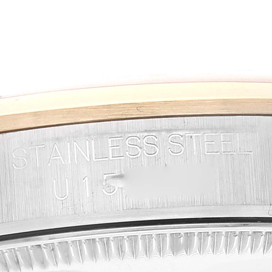 The image shows a close-up of the side of the Mid-Size Rolex watch case, displaying the "STAINLESS STEEL" engraving.