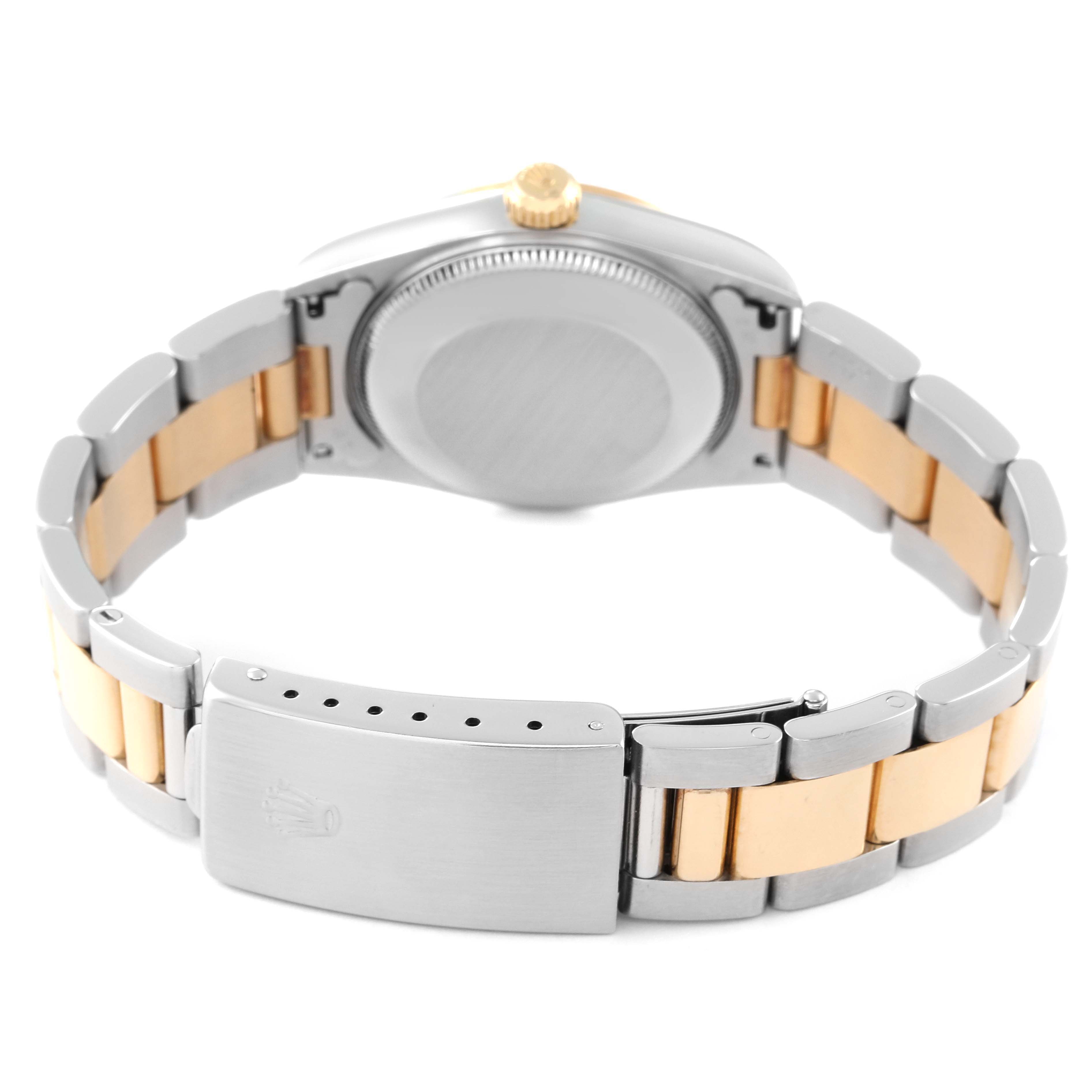 The image shows the backside and clasp of a Mid-Size Rolex watch, highlighting the bracelet and case back.