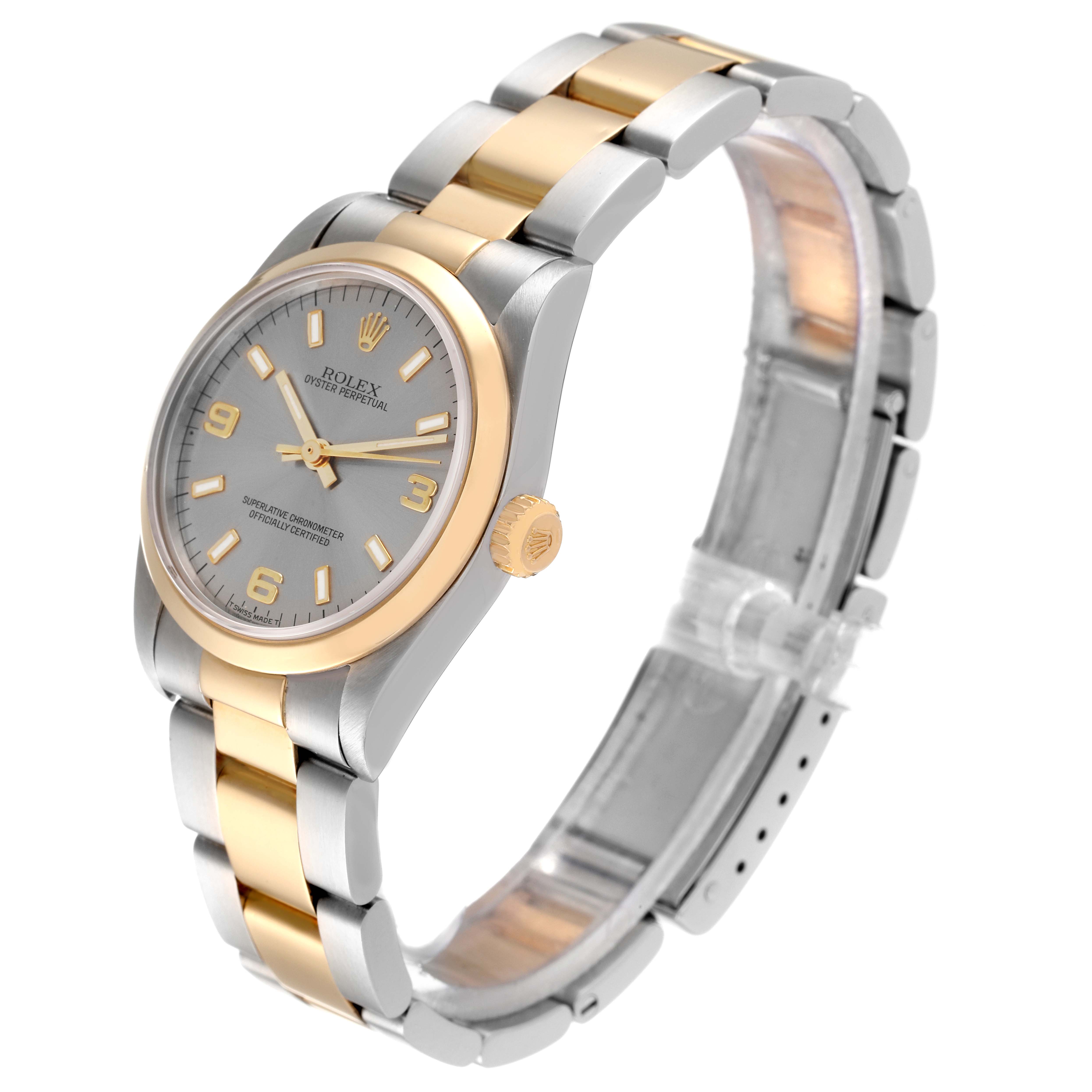 This Rolex Mid-Size 67483 Women's Steel and Gold (two tone) Grey Dial 67483 Women's Steel and Gold (two tone) Grey Dial model watch is shown at an angled view, highlighting its two-tone band, dial, case, and crown.
