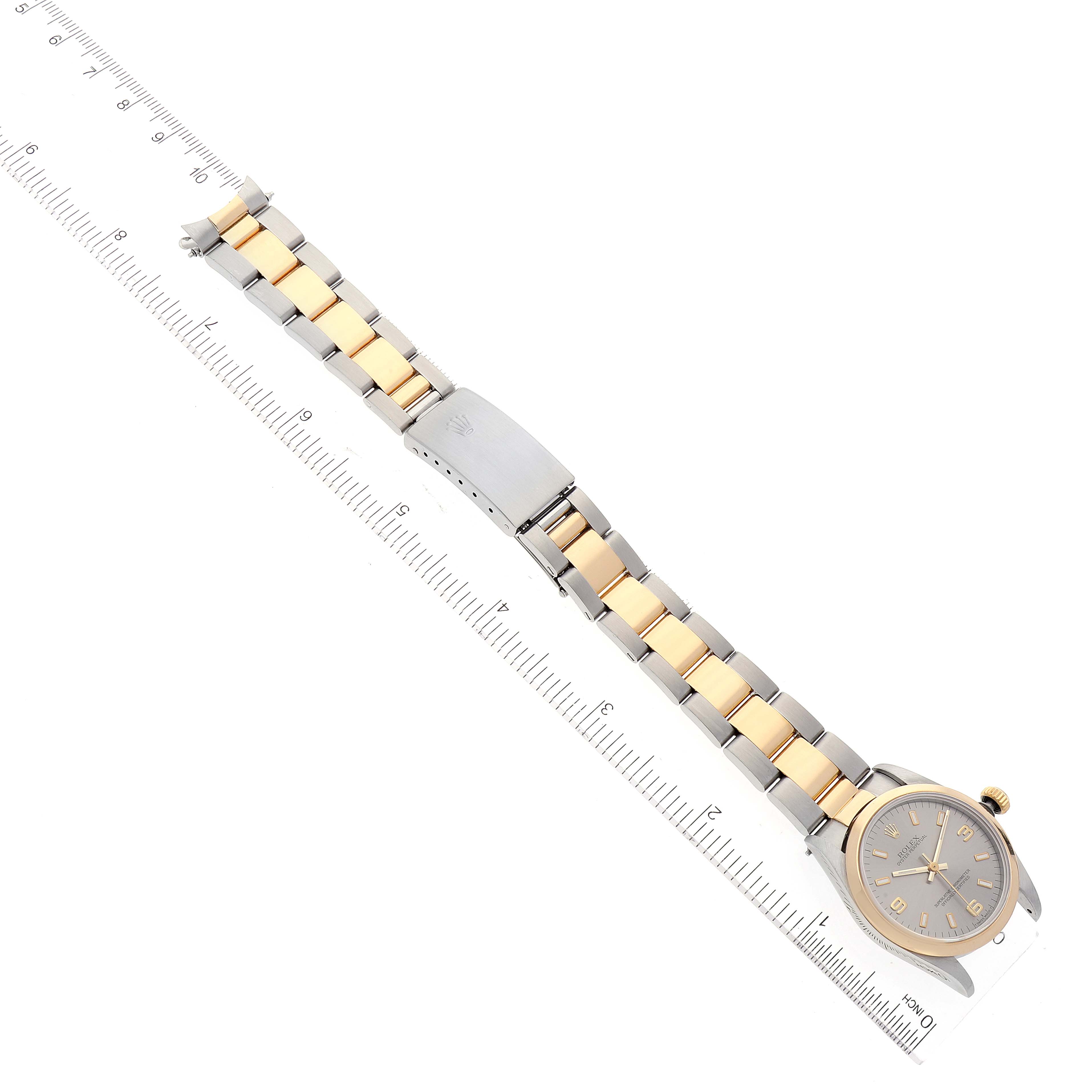 The image shows a two-tone Rolex Mid-Size 67483 Women's Steel and Gold (two tone) Grey Dial 67483 Women's Steel and Gold (two tone) Grey Dial watch laid flat with a stainless steel and gold bracelet.