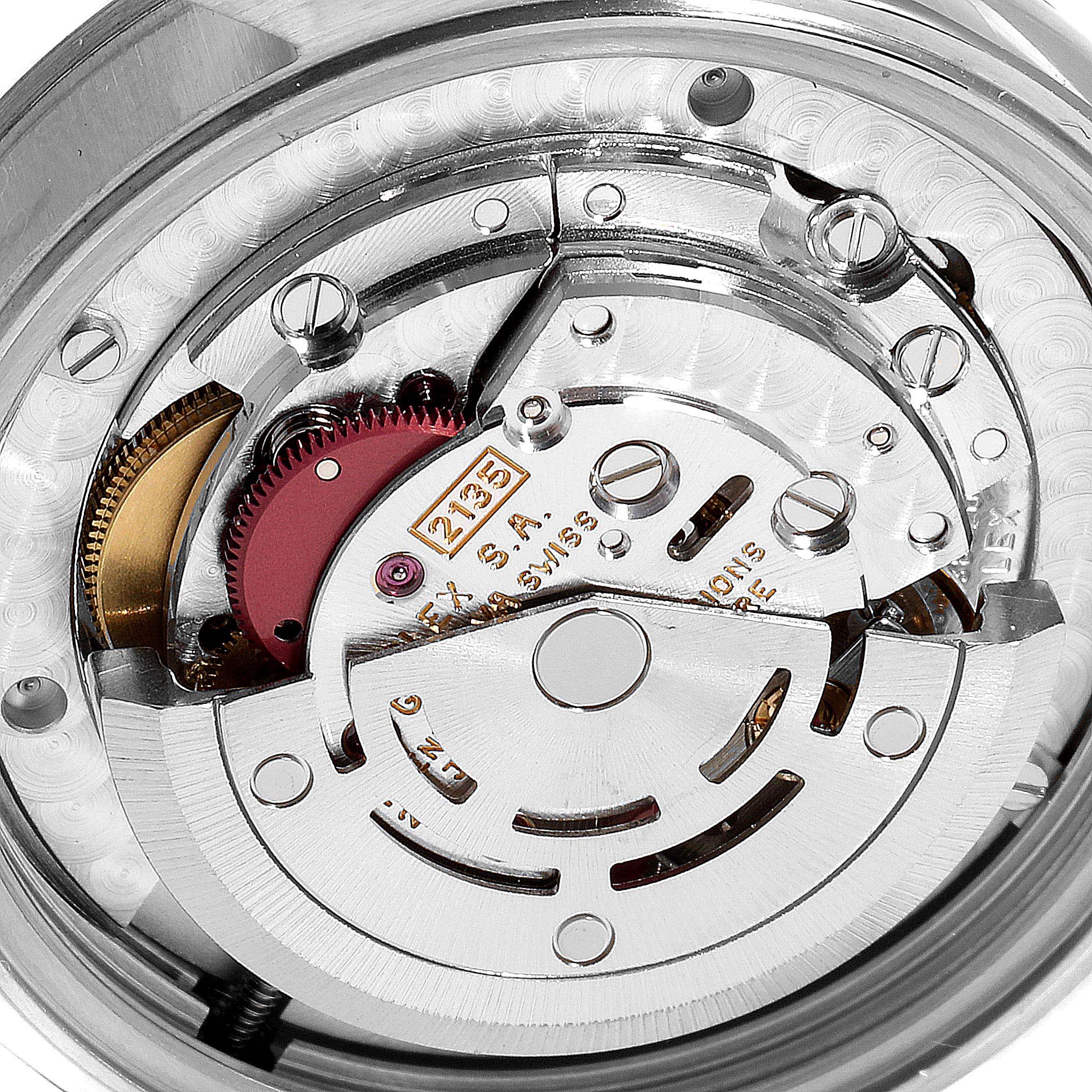 This image shows a close-up of the movement mechanism of a Rolex Mid-Size 68240 Women
s Stainless Steel Pink Dial 68240 Women
s Stainless Steel Pink Dial model watch.
