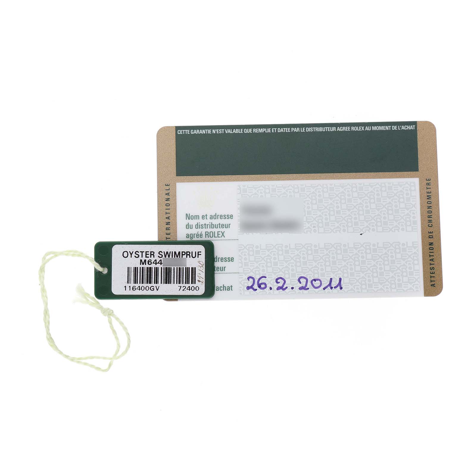 The image shows a Rolex Milgauss 116400GV Men's Stainless Steel Black Dial warranty card and a tag labeled "Oyster Swimpruf" with a serial number.