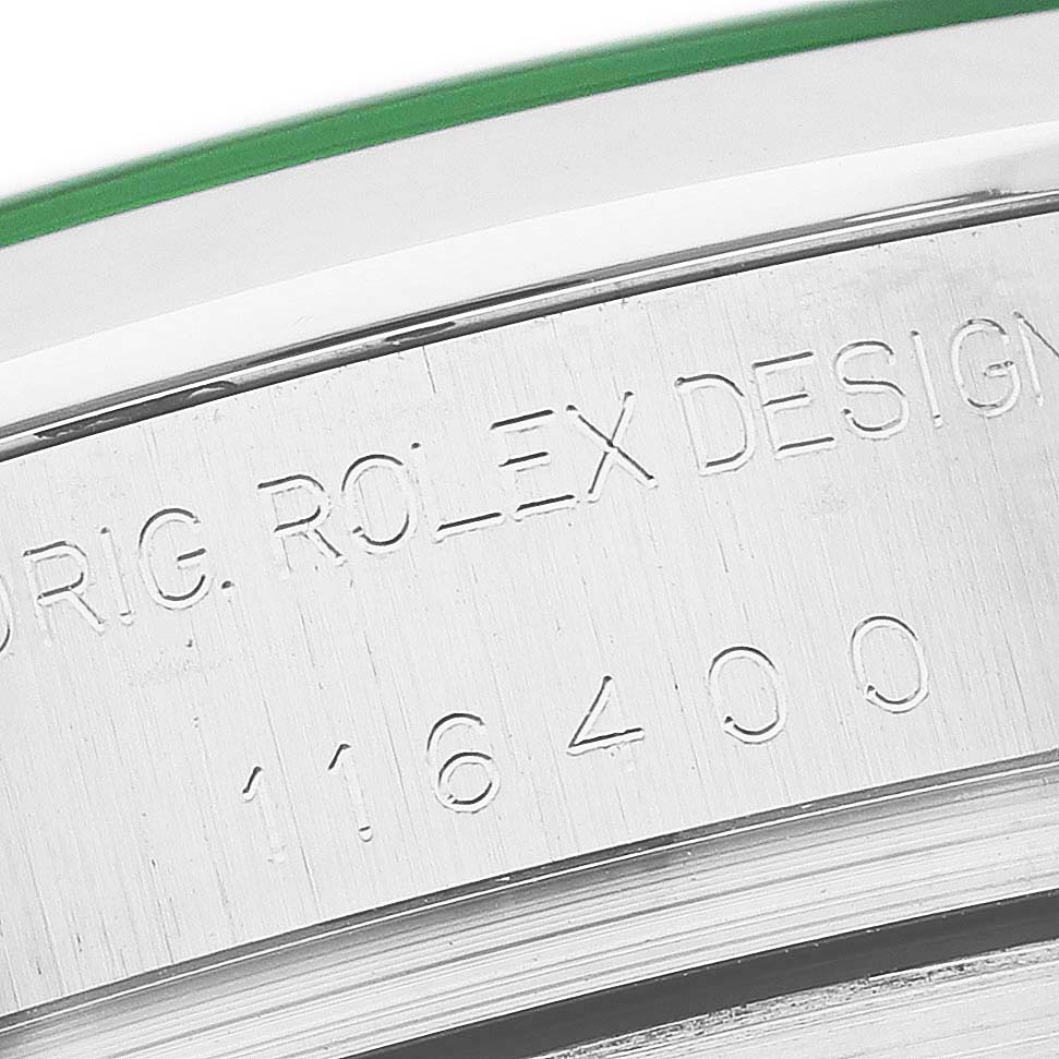 The image shows an engraved side view of the case of a Rolex Milgauss 116400GV Men's Stainless Steel Black Dial, highlighting its model number.
