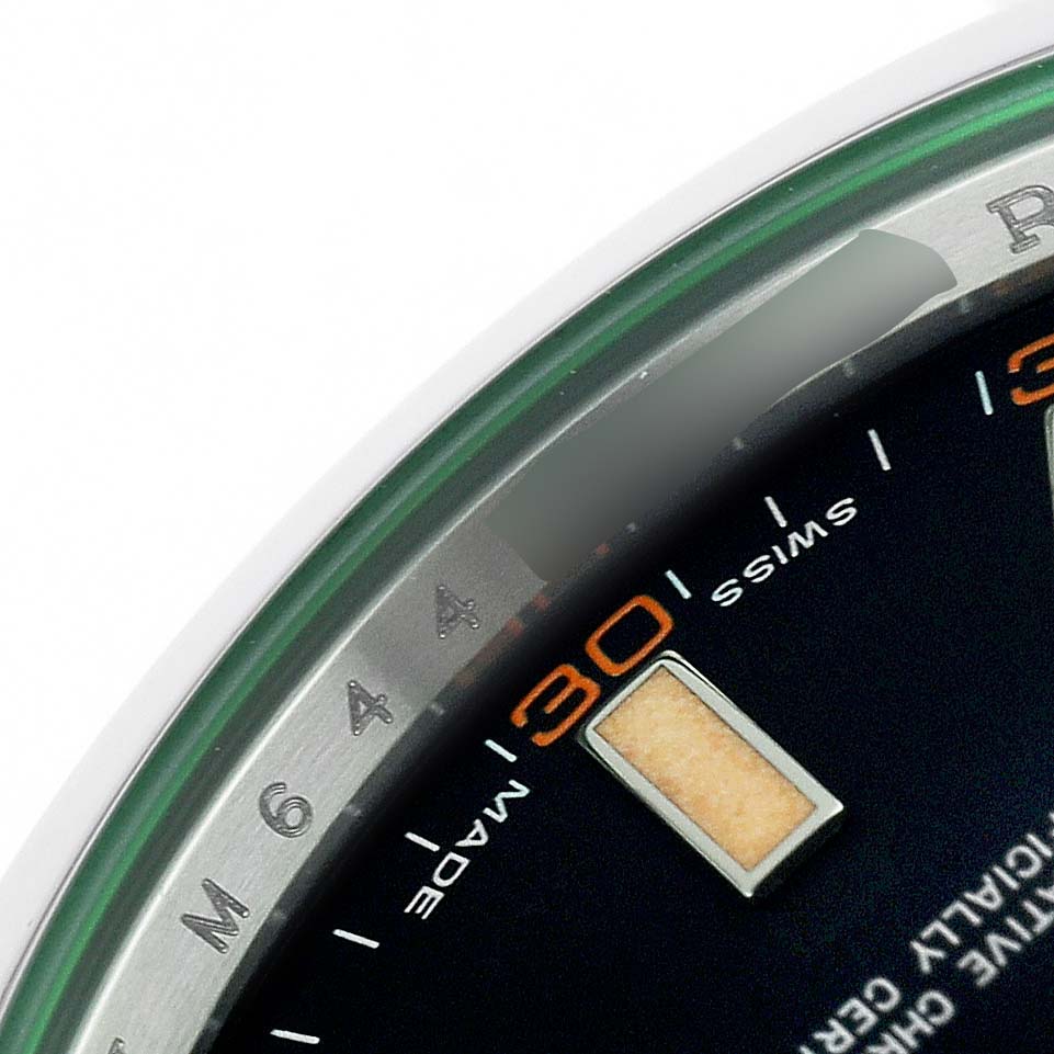The image shows a close-up of the Rolex Milgauss 116400GV Men's Stainless Steel Black Dial watch dial, emphasizing the 3 o'clock position and green-tinted crystal edge.