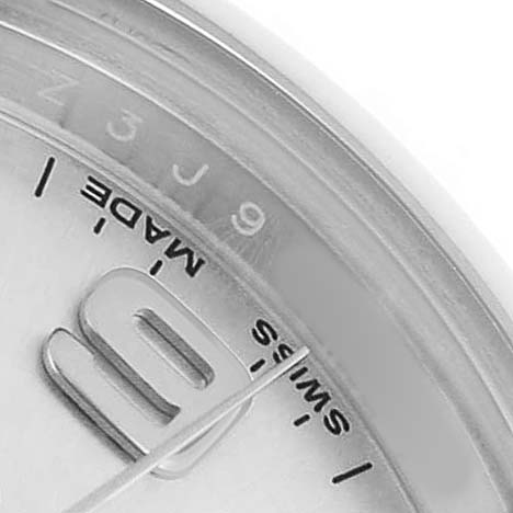 The image shows a close-up of the Rolex Oyster Perpetual 176200 Women's Stainless Steel Silver Dial watch's dial, highlighting elements like the hands, indices, and "Swiss Made" text.