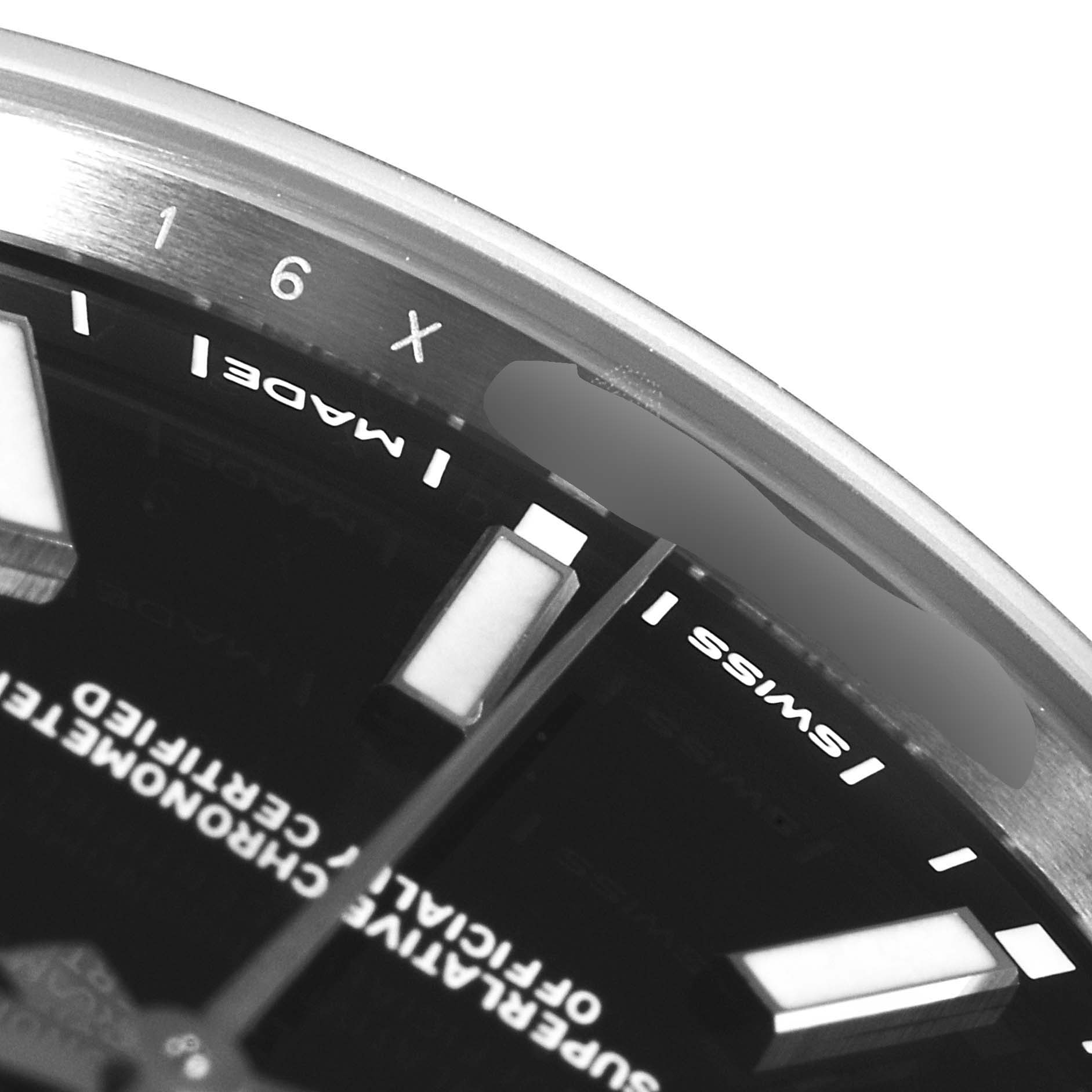 This image shows a close-up of the dial and bezel of the Rolex Oyster Perpetual 114300 Men's Stainless Steel Black Dial 114300 Men's Stainless Steel Black Dial watch.