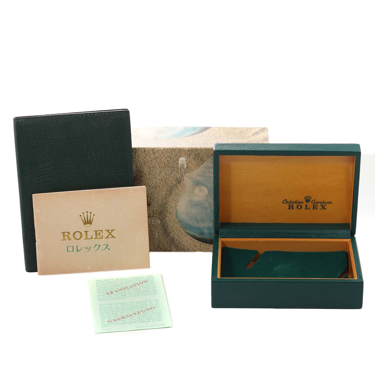 This image shows the packaging and accessories for a Rolex Oysterquartz 17000 Men's Stainless Steel Silver Dial 17000 Men's Stainless Steel Silver Dial, including the inner box, outer box, booklet, and papers.