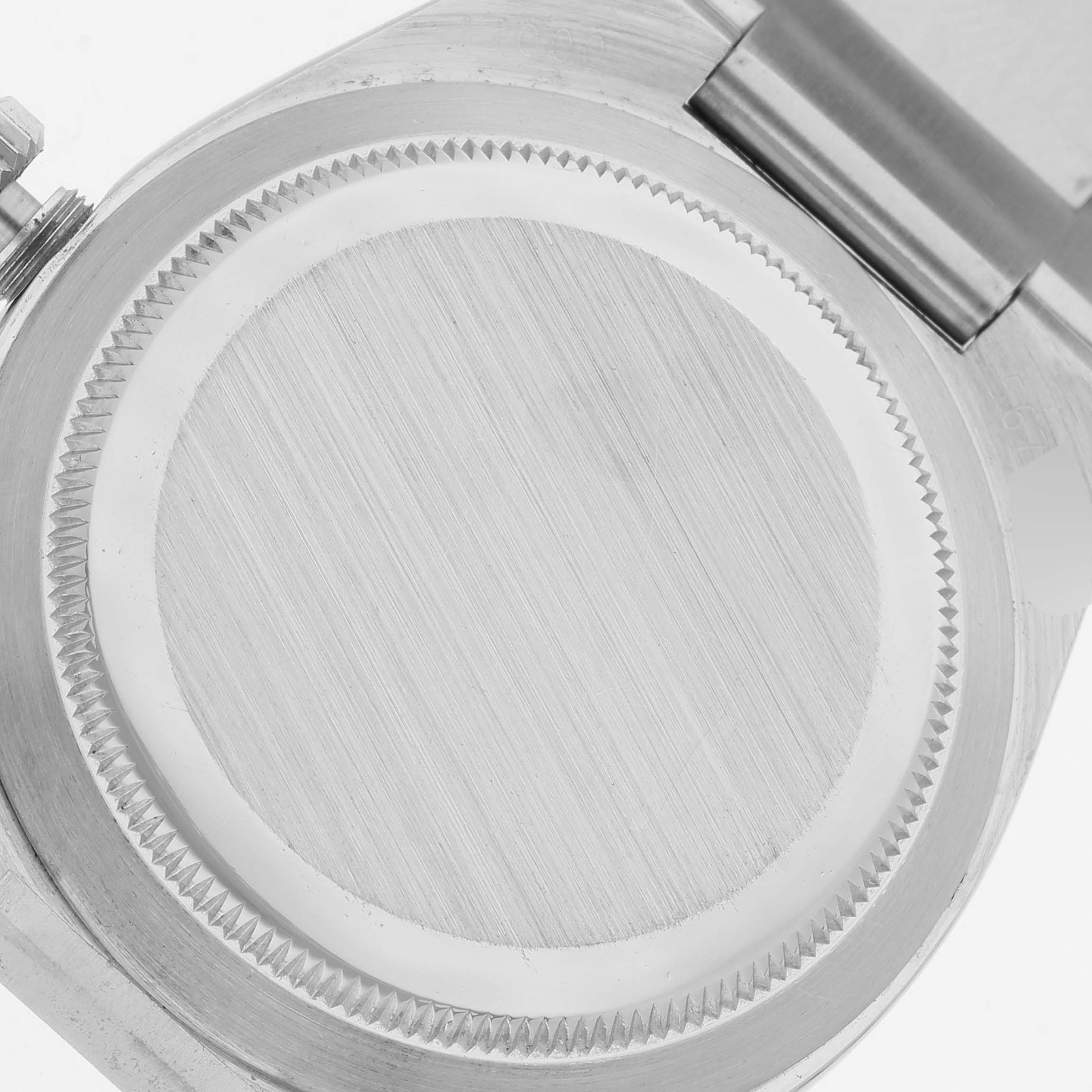 The image shows the back case and part of the bracelet hinge of a Rolex Oysterquartz 17000 Men's Stainless Steel Silver Dial 17000 Men's Stainless Steel Silver Dial watch.