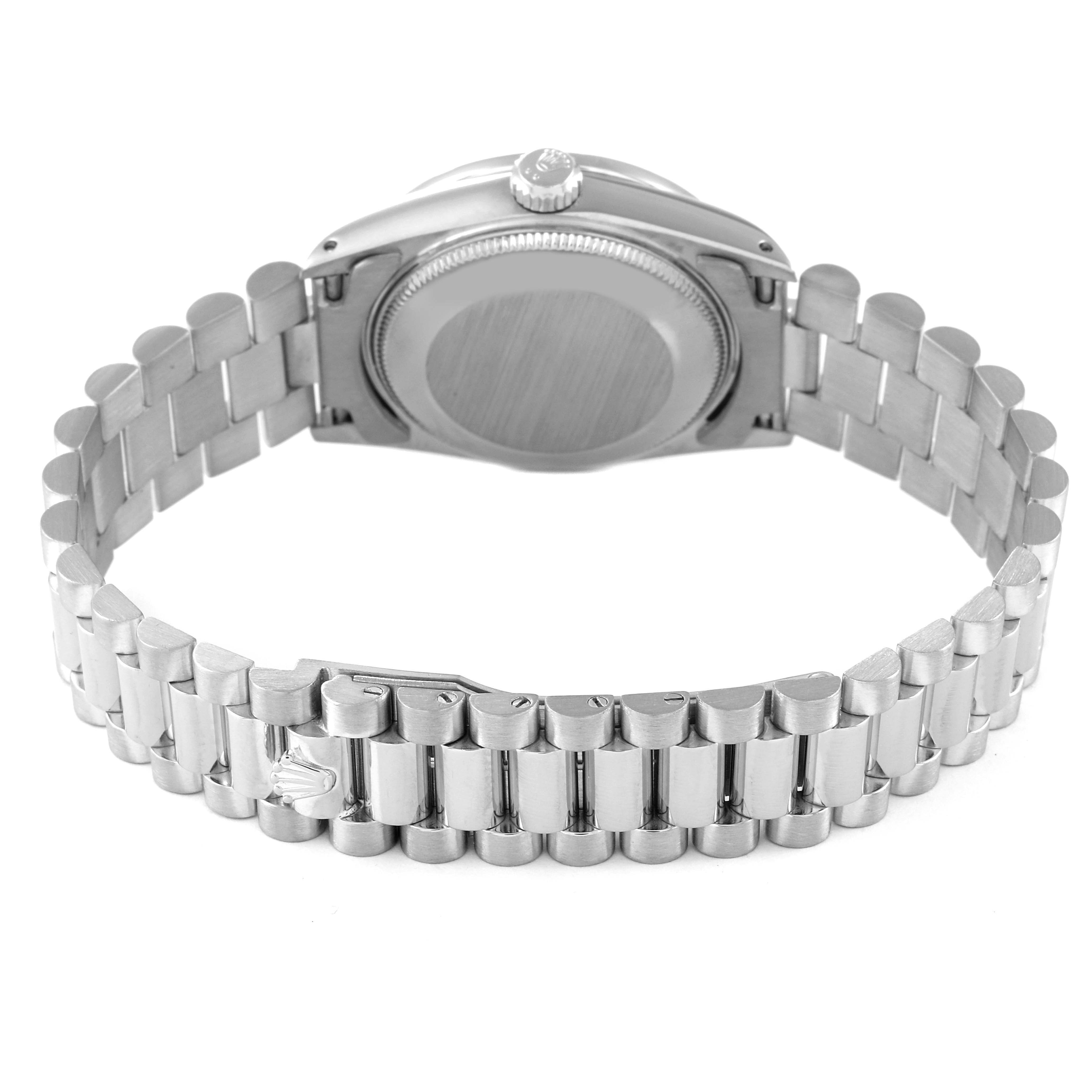 The image shows the back view of a Rolex President 68289 Women
s White Gold Silver Dial 68289 Women
s White Gold Silver Dial model watch, highlighting its bracelet and clasp.
