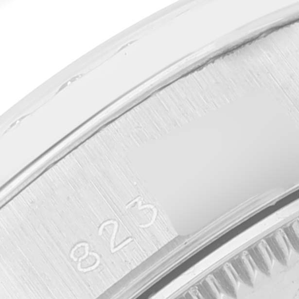 This is a close-up shot showing the edge of the bezel and part of the casing of a Rolex President 68289 Women
s White Gold Silver Dial 68289 Women
s White Gold Silver Dial model watch.