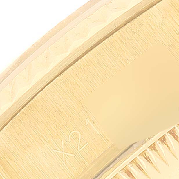 This image shows a close-up of the side and part of the bezel of a Rolex President 69178 Women
s Yellow Gold Champagne Dial 69178 Women
s Yellow Gold Champagne Dial model watch.