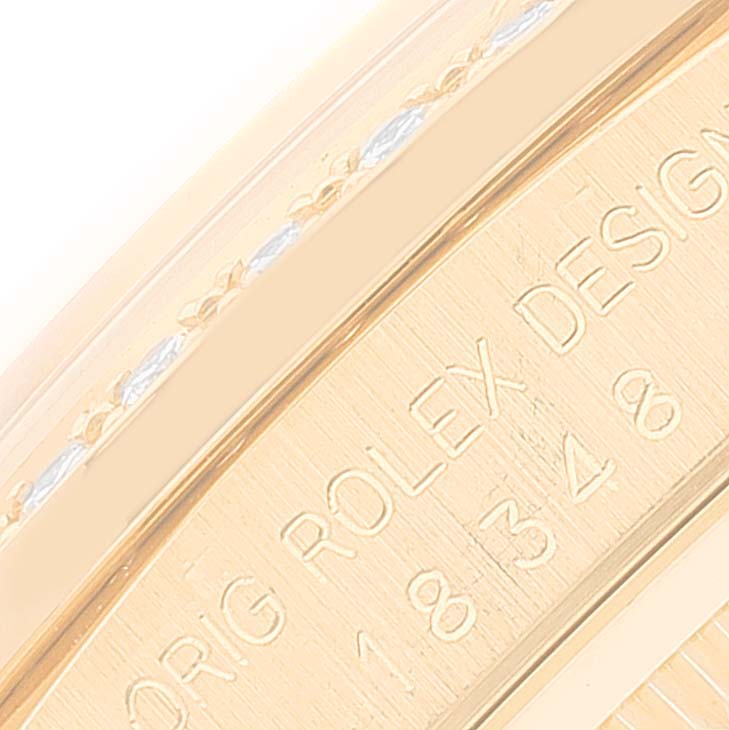 The image shows a close-up of the engraved caseback of a Rolex President 18348 Men
s Yellow Gold Champagne Dial 18348 Men
s Yellow Gold Champagne Dial model watch.