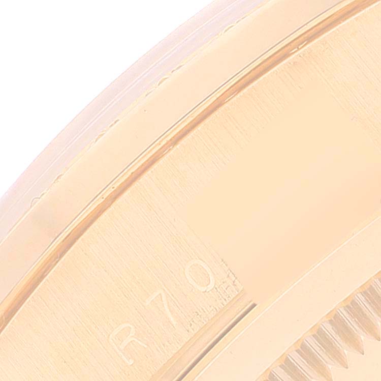 This close-up image shows the side profile of the bezel and part of the case of a Rolex President 18348 Men
s Yellow Gold Champagne Dial 18348 Men
s Yellow Gold Champagne Dial model watch.