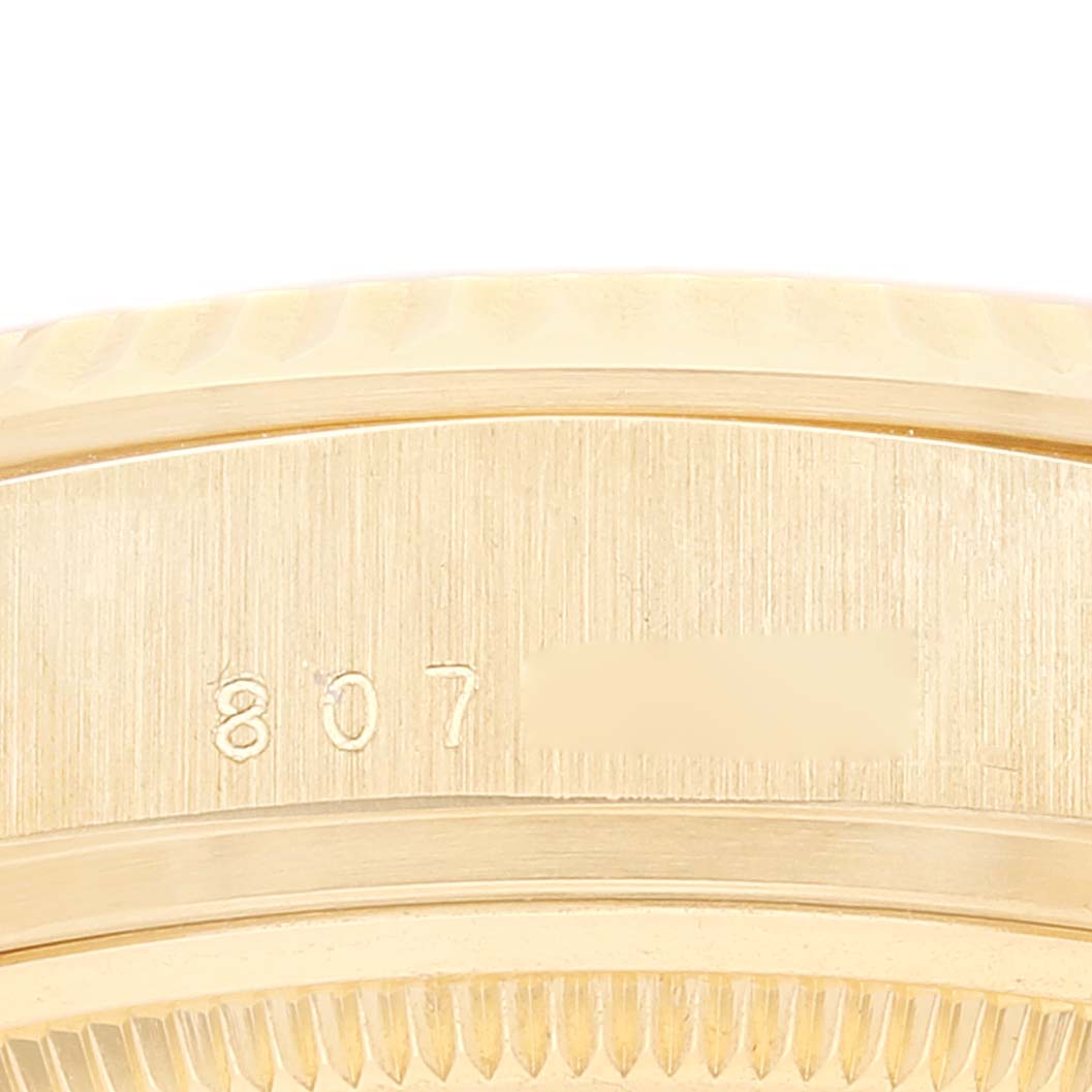 The image shows a close-up of the side of the case of a Rolex President 18038 Men's Steel and Gold (two tone) Champagne Dial 18038 Men's Steel and Gold (two tone) Champagne Dial model watch, focusing on the serial number engraving.
