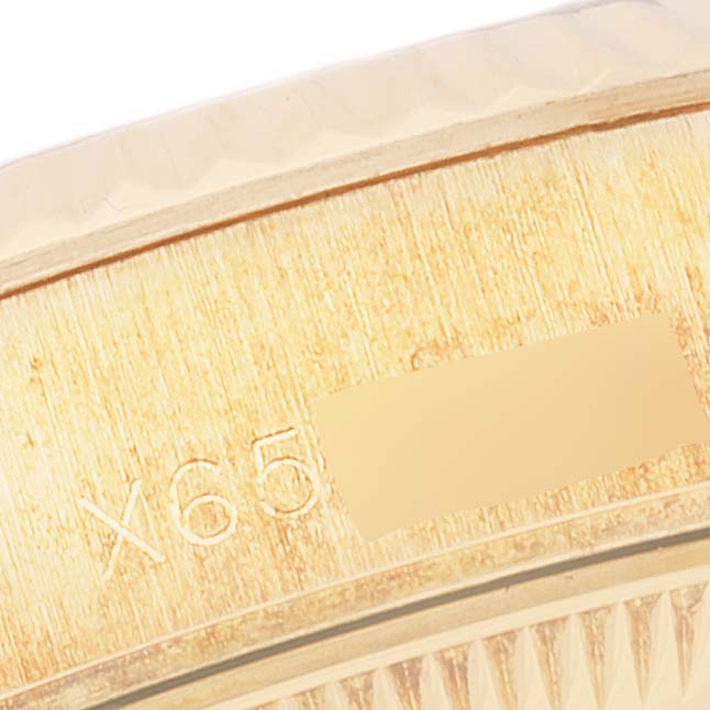 This is a close-up angle showing the serial number area on the case of a Rolex President 69178 Women
s Yellow Gold Champagne Dial 69178 Women
s Yellow Gold Champagne Dial model watch.