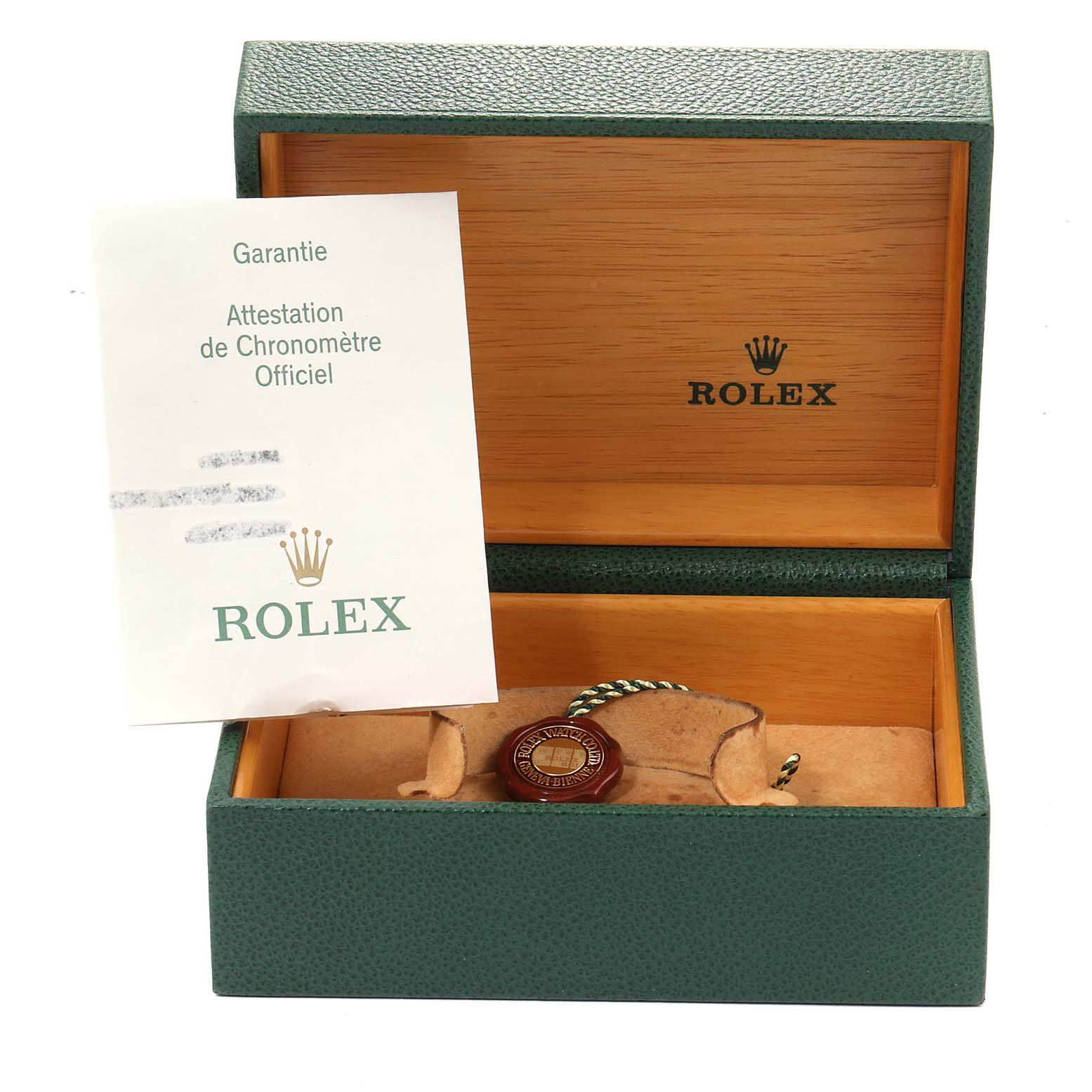 The image shows the open presentation box and guarantee certificate for a Rolex Sea-Dweller 16600 Men
s Stainless Steel Black Dial 16600 Men
s Stainless Steel Black Dial watch.