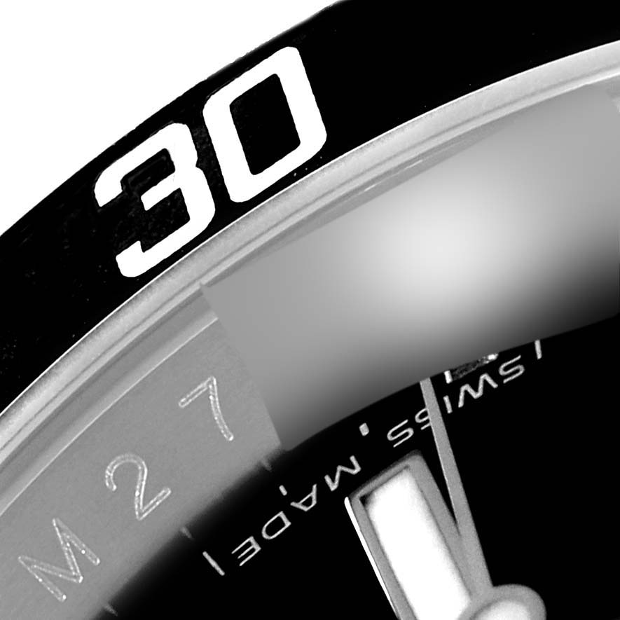 The image shows a close-up angle of the bezel, dial, and minute hand of a Rolex Submariner 16610 Men
s Stainless Steel Black Dial 16610 Men
s Stainless Steel Black Dial.