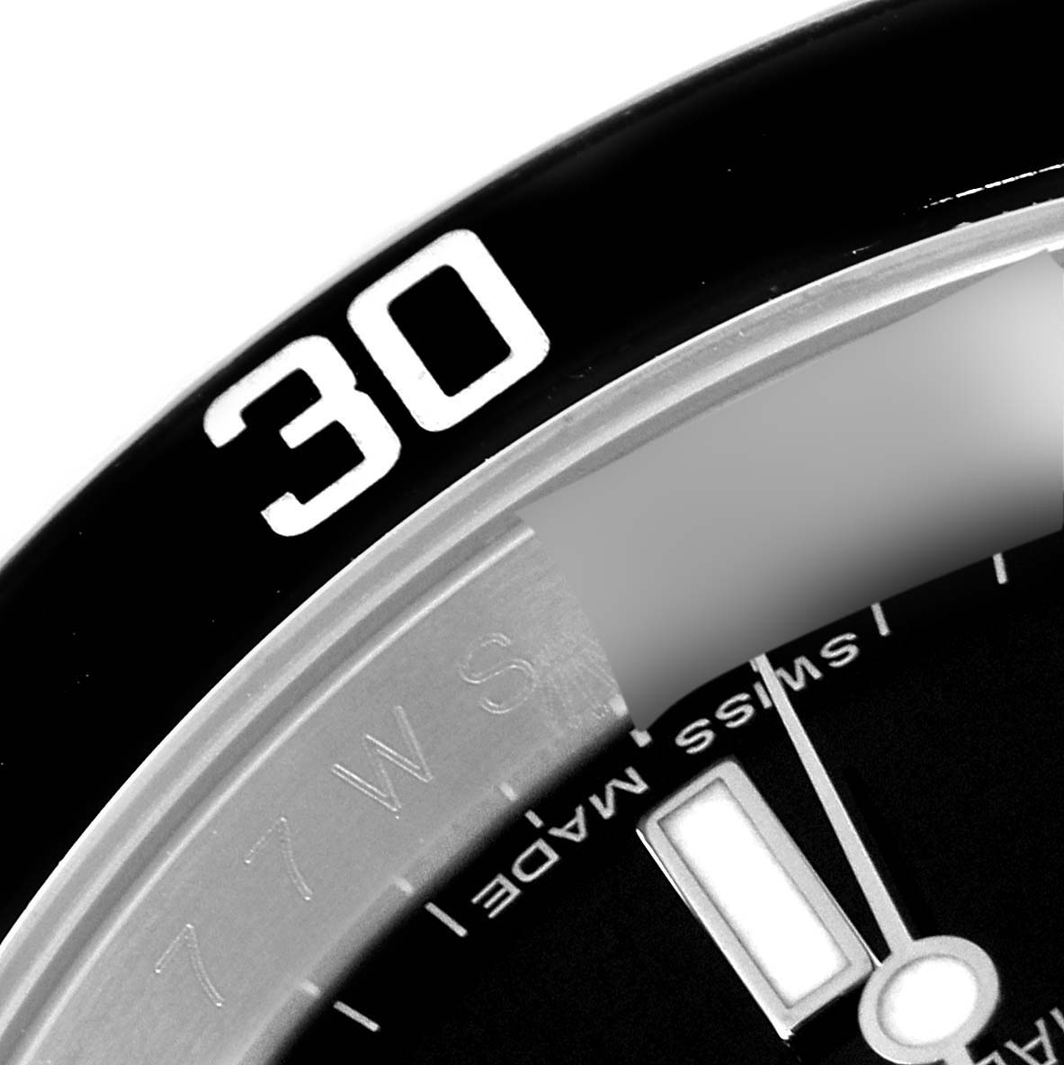 The image shows a close-up of the bezel and part of the dial on a Rolex Submariner 16610 Men
s Stainless Steel Black Dial 16610 Men
s Stainless Steel Black Dial watch.