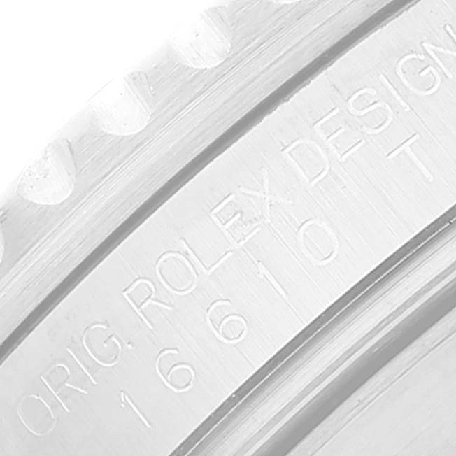 The image shows a close-up of the engraved bezel of a Rolex Submariner 16610 Men
s Stainless Steel Black Dial 16610 Men
s Stainless Steel Black Dial 16610 watch.