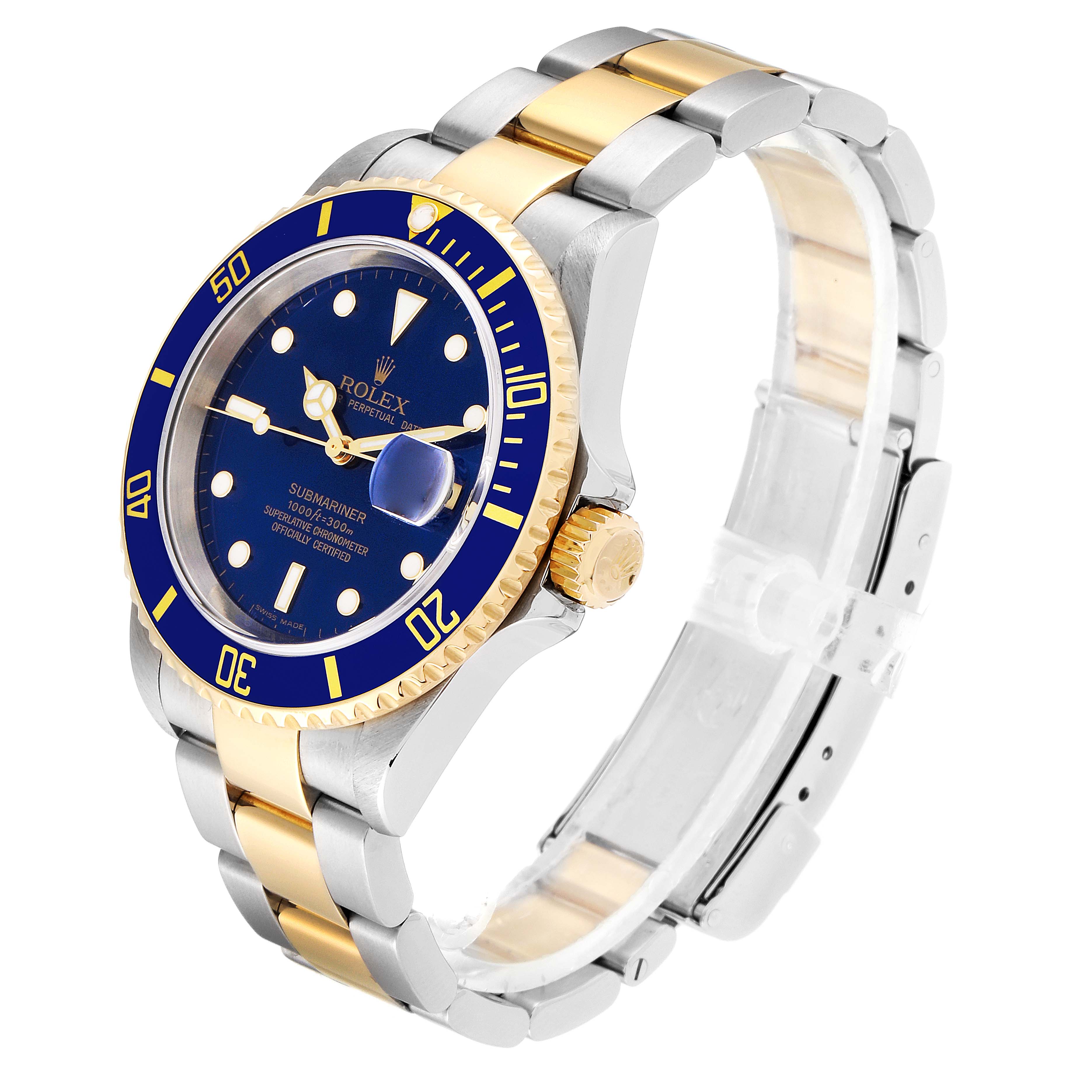 The image shows a side angle of the Rolex Submariner 16613 Men
s Steel and Gold (two tone) Blue Dial 16613 Men
s Steel and Gold (two tone) Blue Dial watch, highlighting its blue dial, gold bezel, and two-tone bracelet.