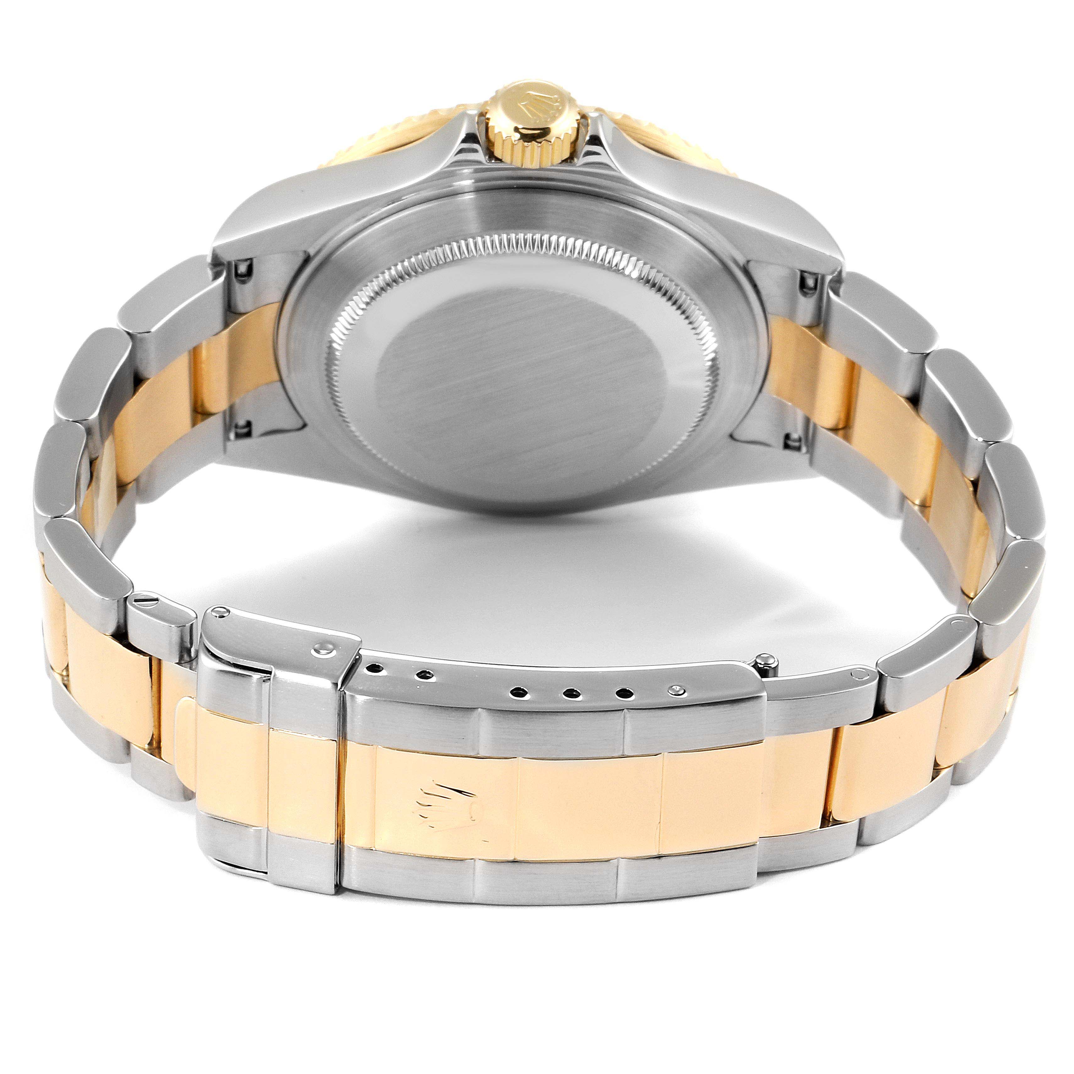 The image shows the back case and band of a Rolex Submariner 16613 Men
s Steel and Gold (two tone) Blue Dial 16613 Men
s Steel and Gold (two tone) Blue Dial, focusing on the two-tone metal links and clasp.