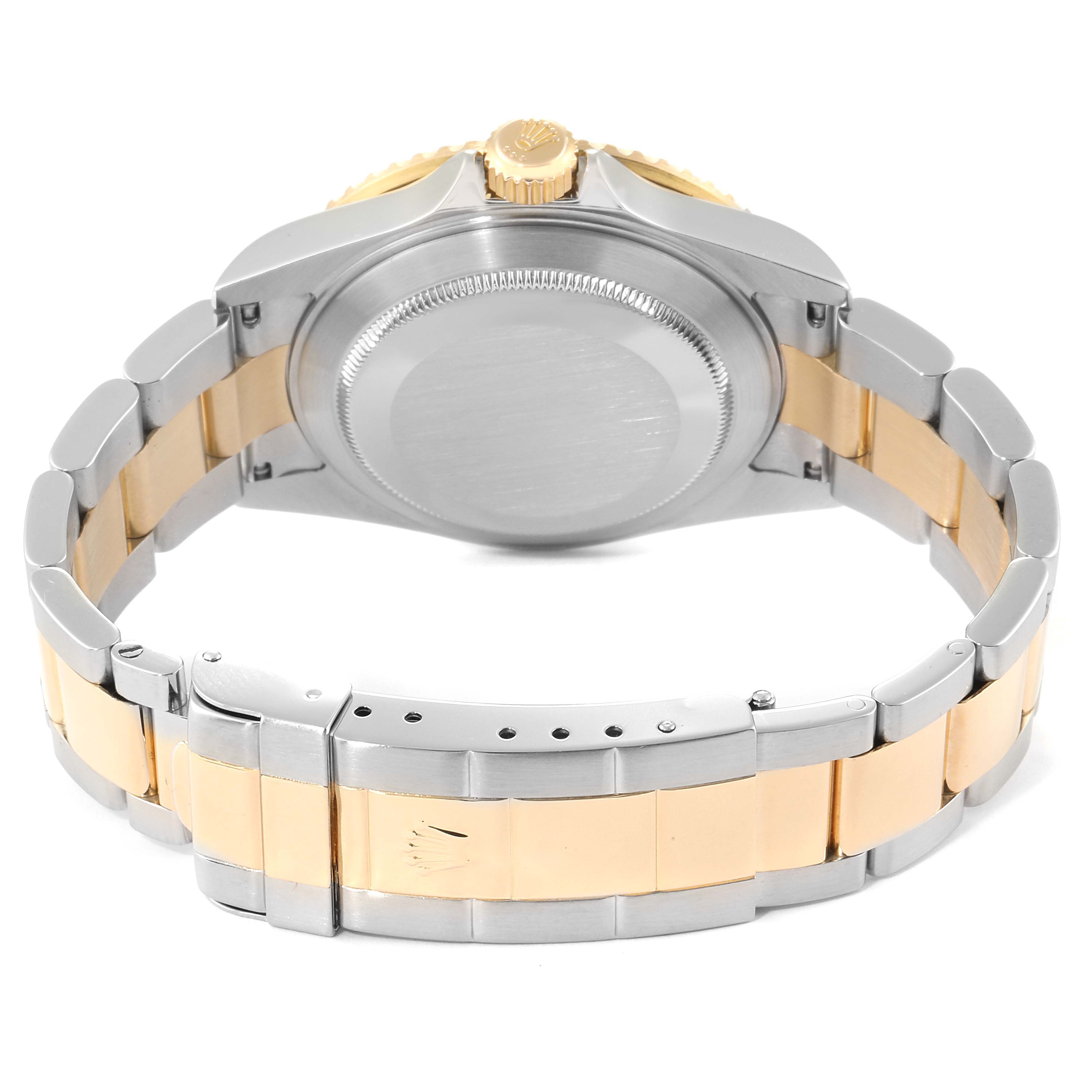 This image shows the back of a Rolex Submariner 16613 Men's Steel and Gold (two tone) Black Dial 16613 Men's Steel and Gold (two tone) Black Dial, focusing on the case back, crown, and two-tone bracelet.