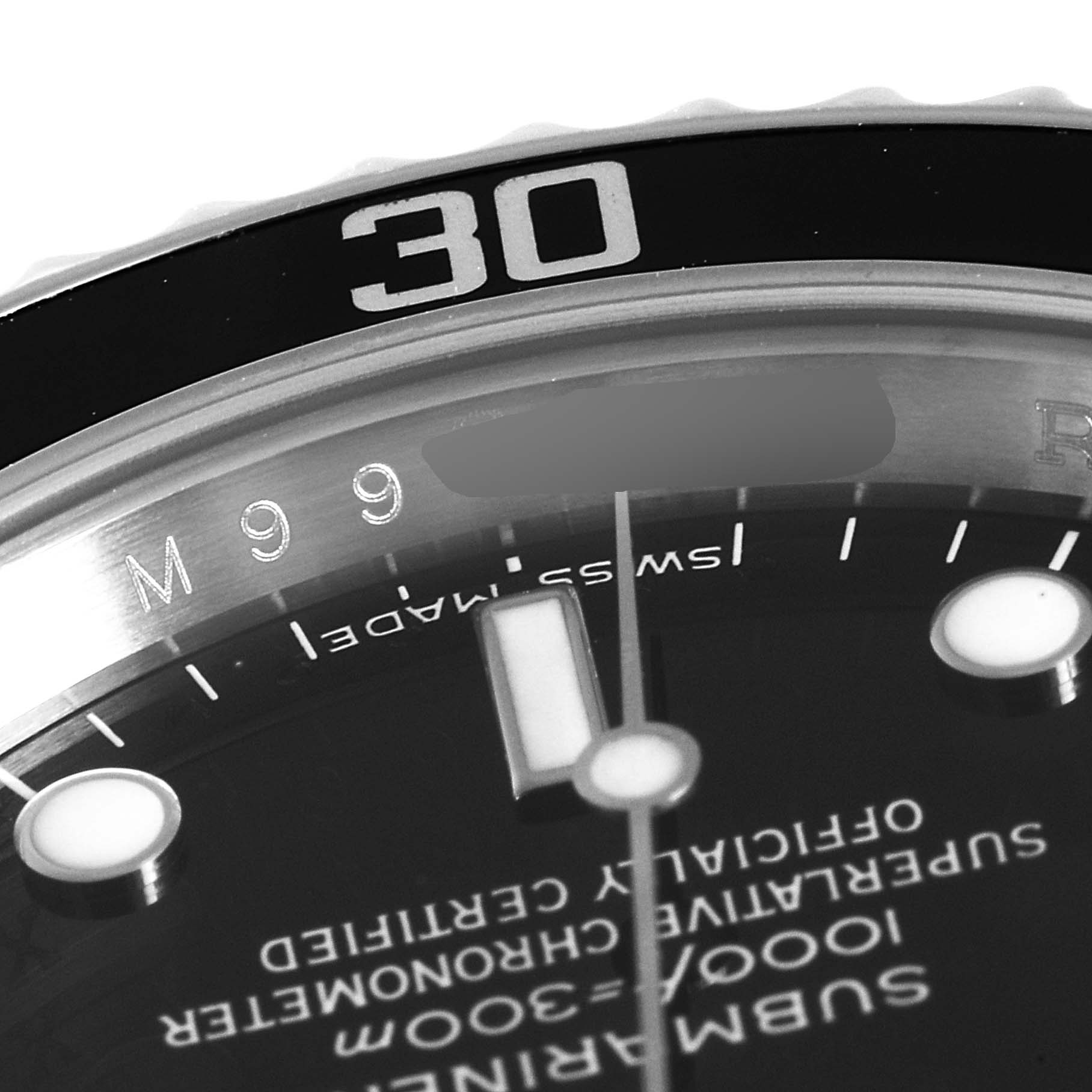 This close-up angle shows the bezel, part of the dial, and the minute hand of a Rolex Submariner 14060M Men
s Stainless Steel Black Dial 14060M Men
s Stainless Steel Black Dial watch.