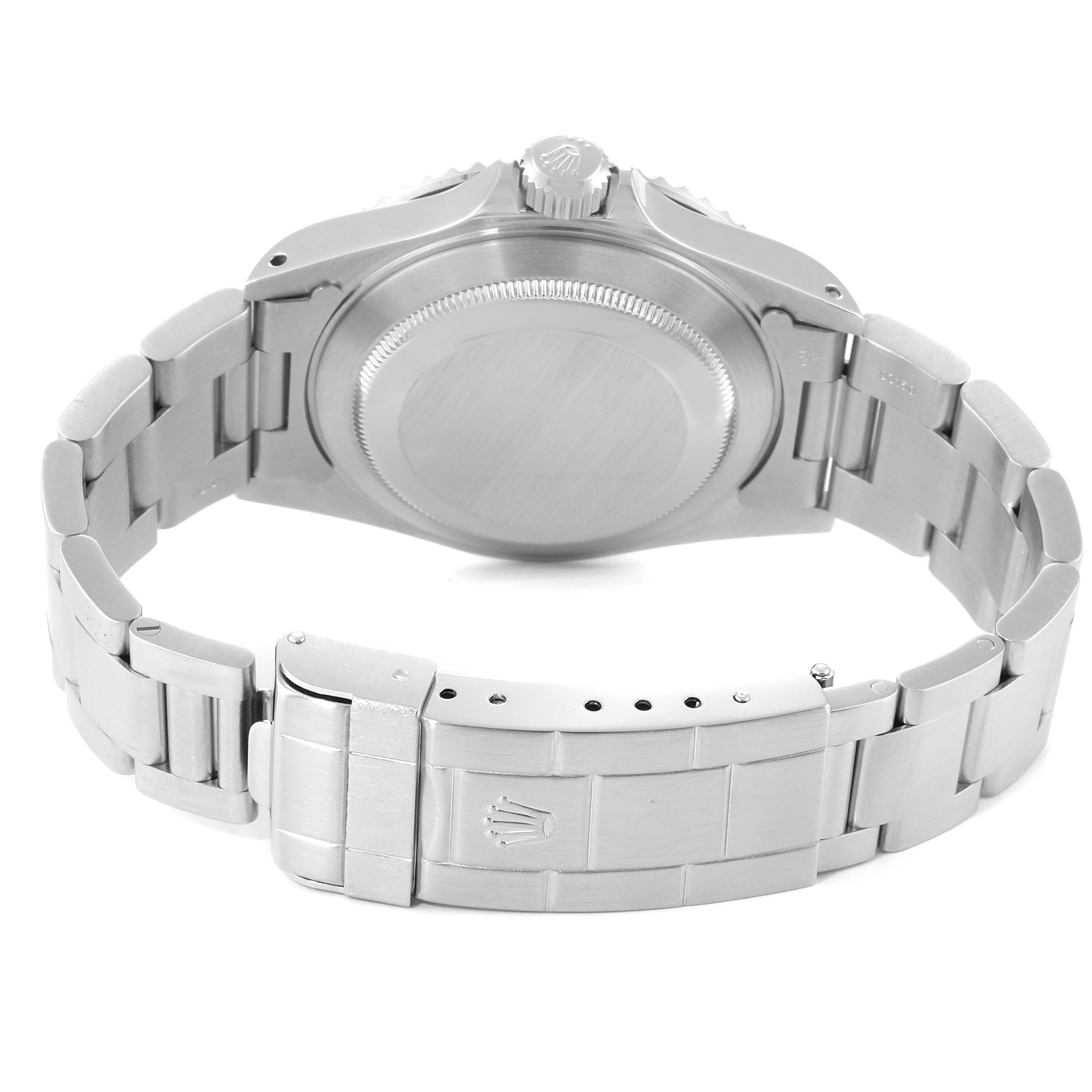 The image shows the back case and bracelet clasp of a Rolex Submariner 14060M Men
s Stainless Steel Black Dial 14060M Men
s Stainless Steel Black Dial watch from a rear angle.