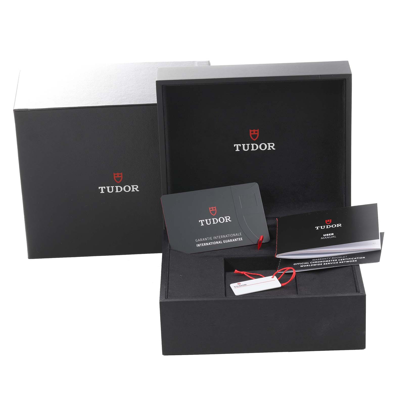 The image shows the box and accessories of the Tudor Heritage Black Bay M79470-0003 Men's Stainless Steel Black Dial M79470-0003 Men's Stainless Steel Black Dial, including the guarantee card and user manual.