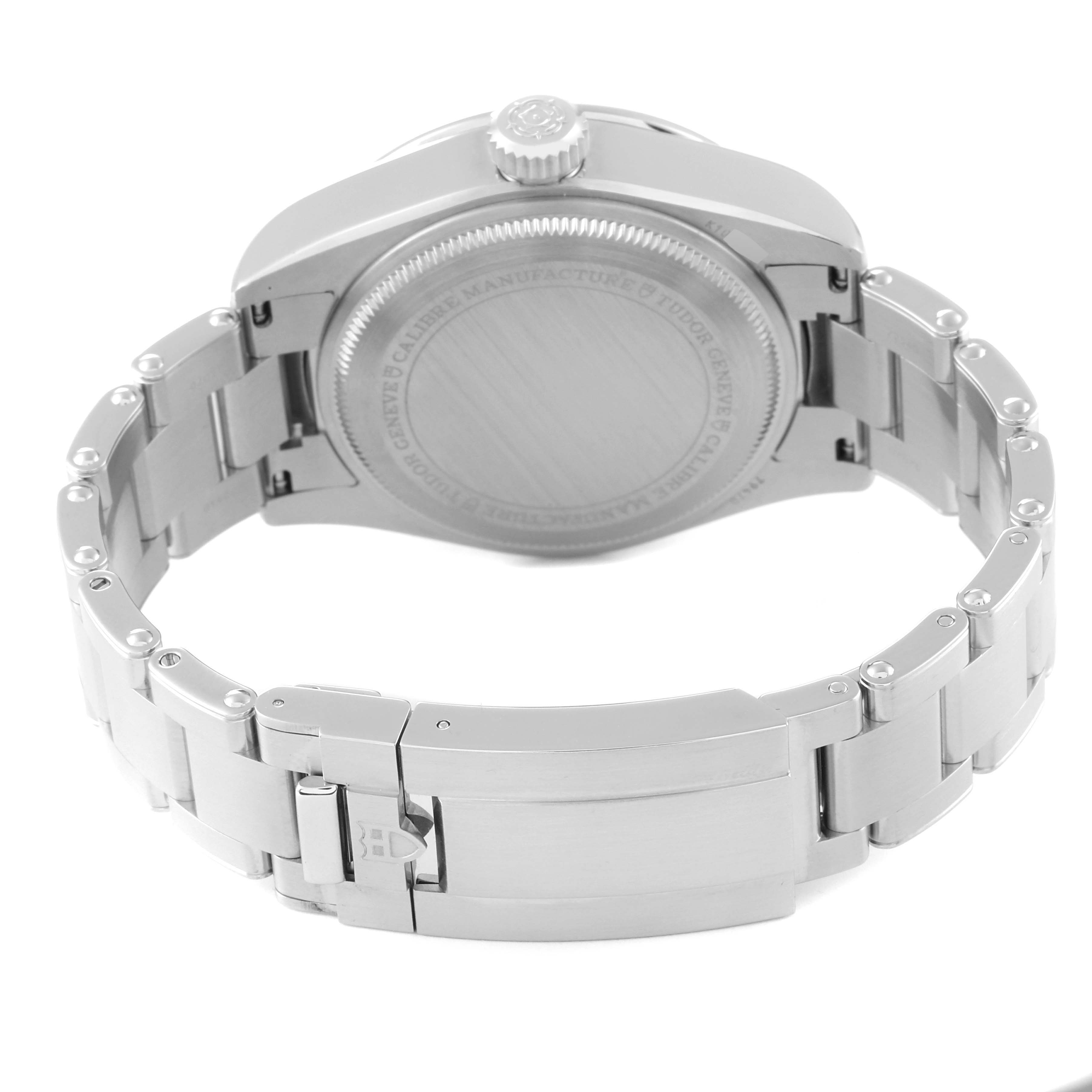 The image shows the back of the Tudor Heritage Black Bay M79470-0003 Men's Stainless Steel Black Dial M79470-0003 Men's Stainless Steel Black Dial watch, highlighting the case back, crown, and stainless steel bracelet.