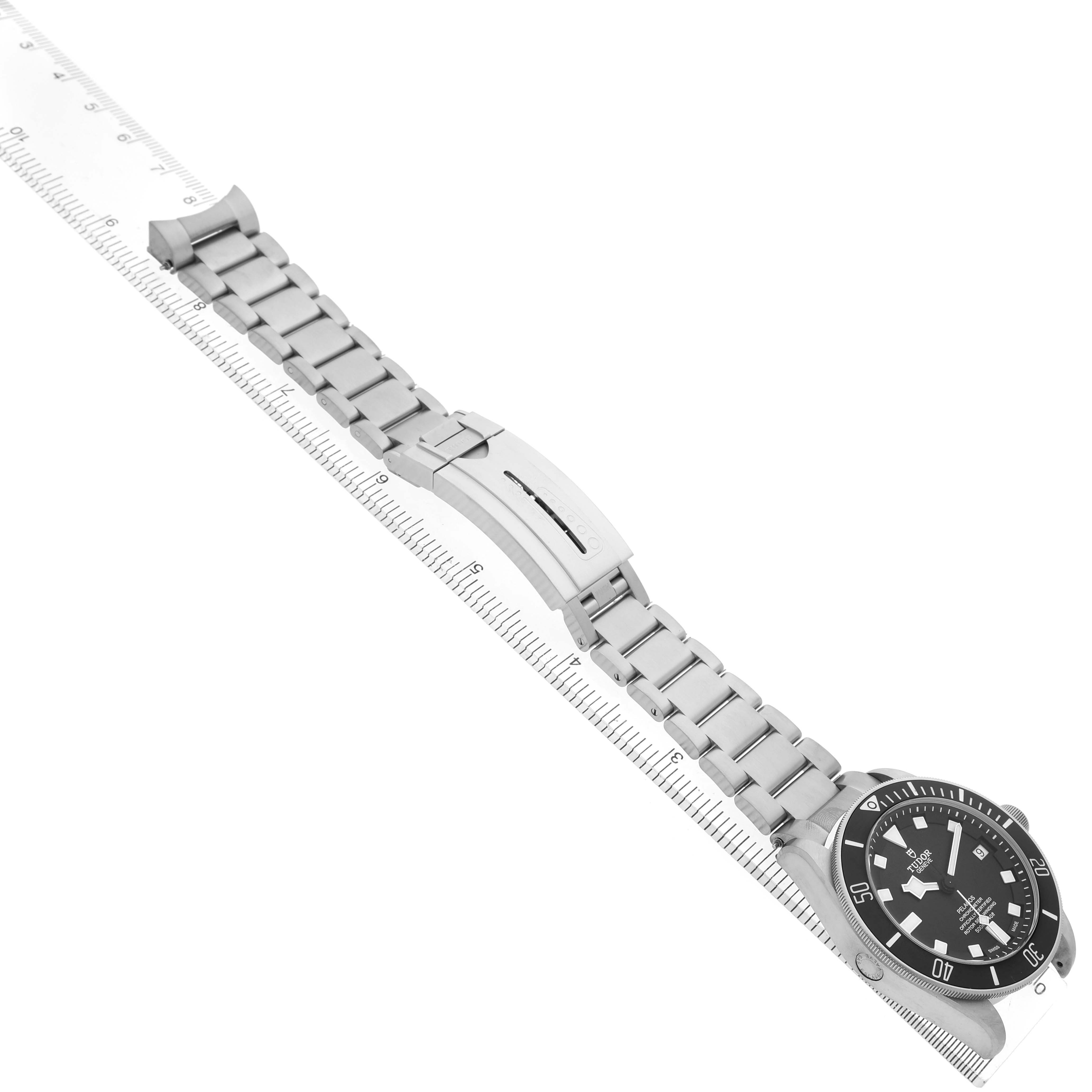 The Tudor Pelagos 25600TN Men's Titanium Black Dial watch is displayed diagonally from the three-quarter angle, showcasing the face, bezel, and bracelet with clasp.