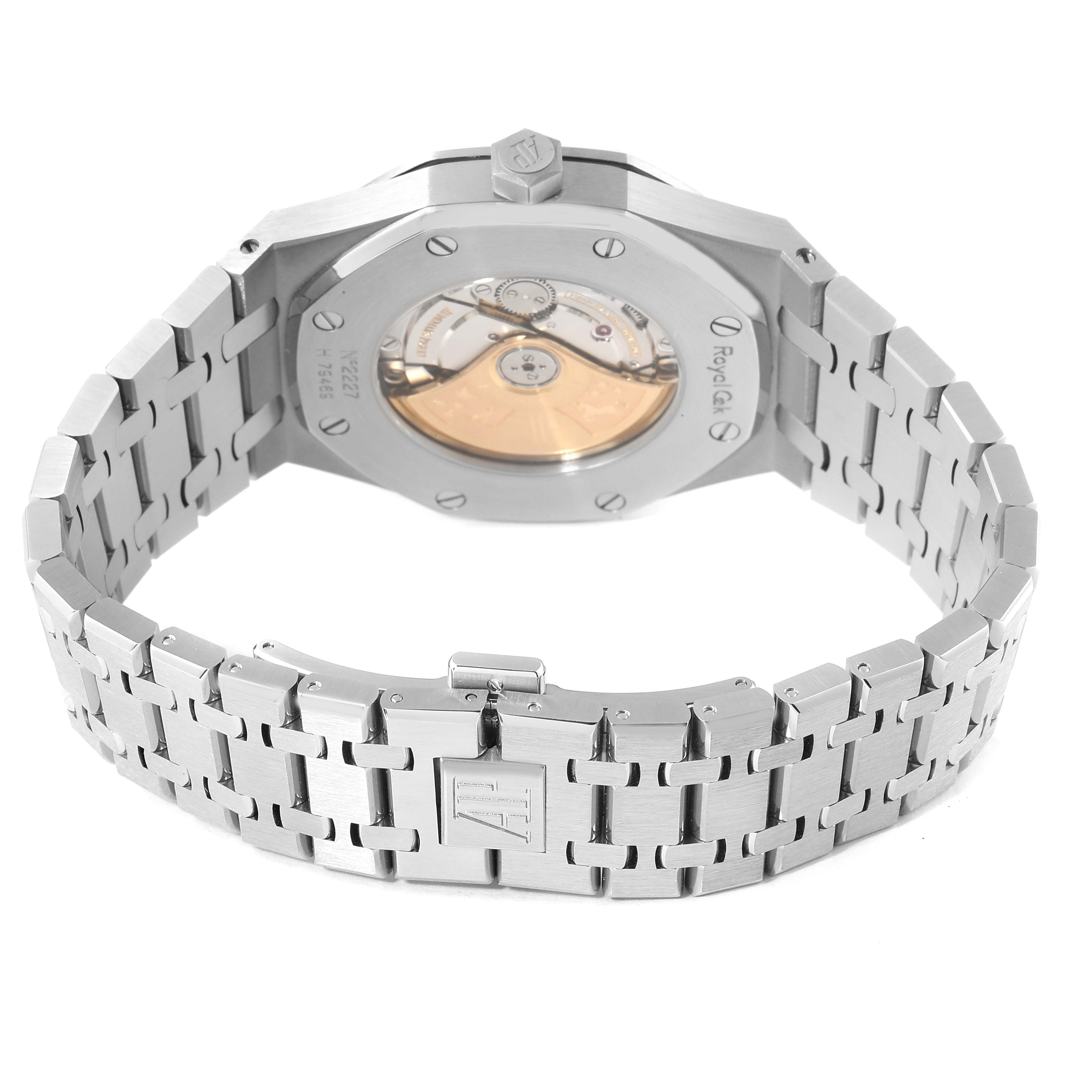 The Royal Oak by Audemars Piguet is shown from the back, displaying its caseback, movement, and stainless steel bracelet.