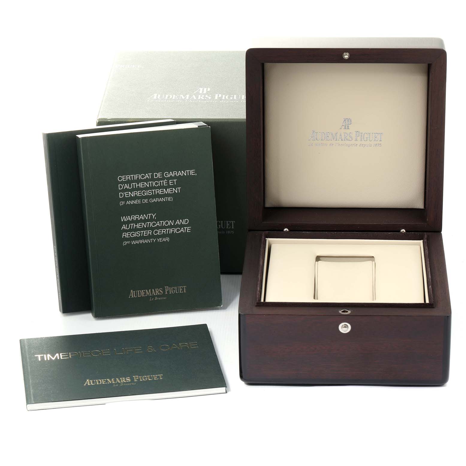 The image shows the packaging and accessories of an Audemars Piguet Royal Oak 15400ST.OO.1220ST.01 Men's Stainless Steel Black Dial 15400ST.OO.1220ST.01 Men's Stainless Steel Black Dial watch, including the box, warranty card, and booklets.